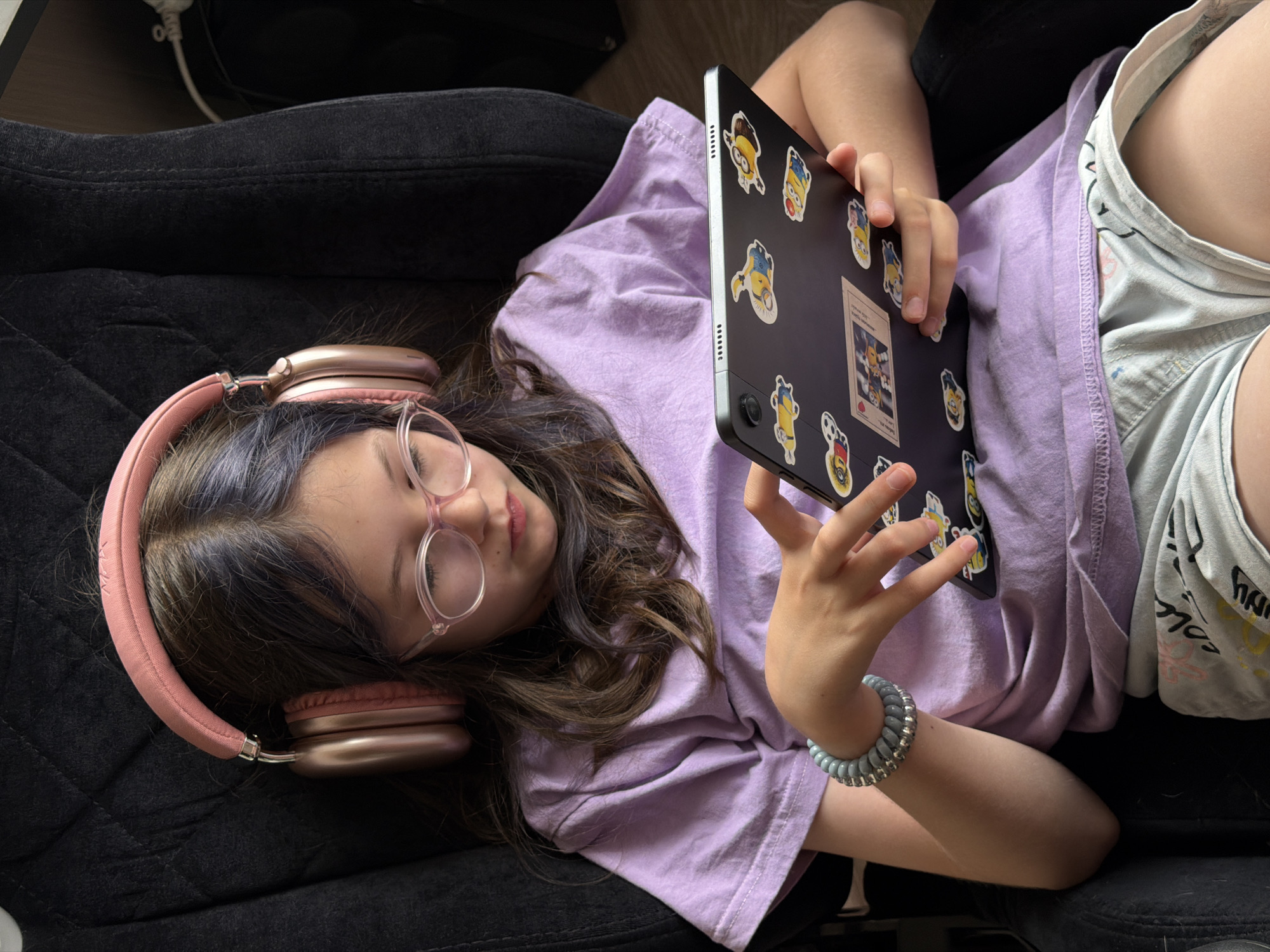 Girl with tablet, Chihuahua play among stuffed animals in Russia