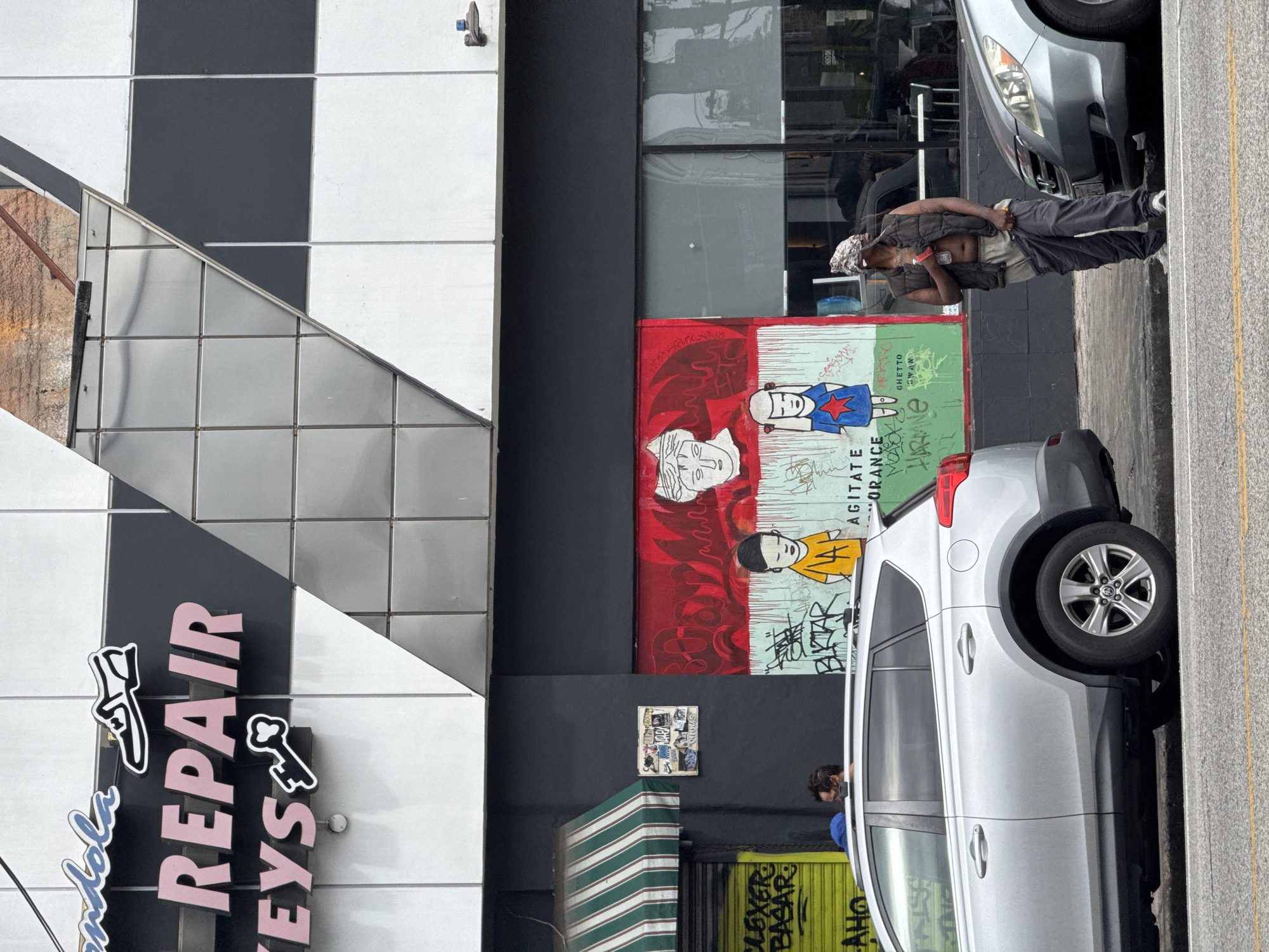 Evening street documentation captures LA business signage, parking areas