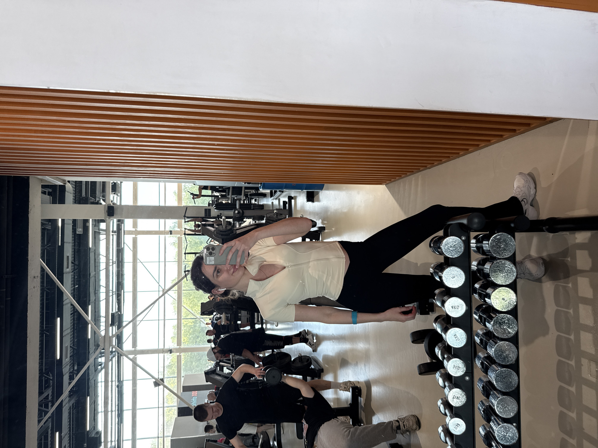 Woman's workout day documented through gym selfies and waterfront visit