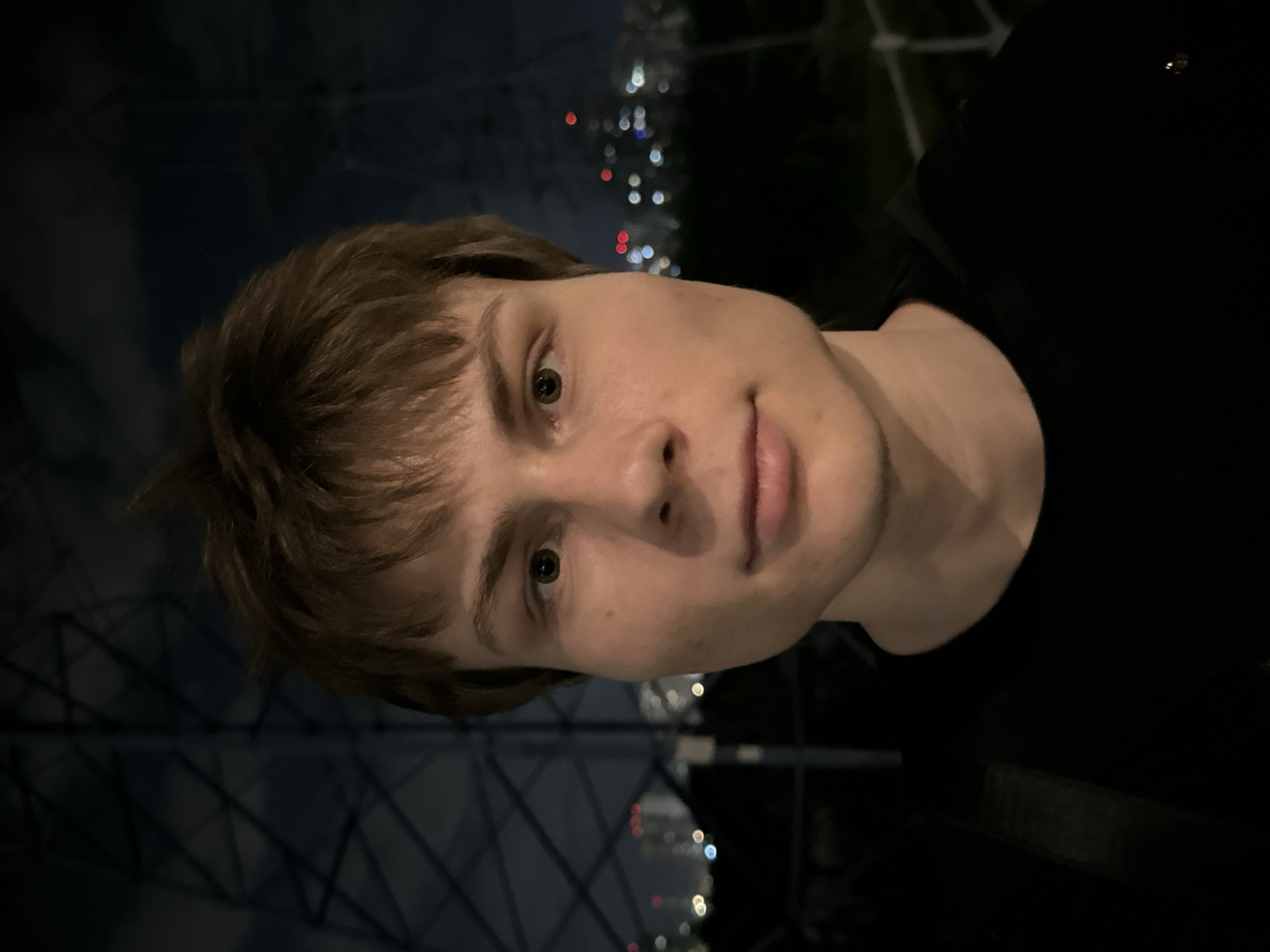 Portrait captured against Moscow nighttime skyline backdrop