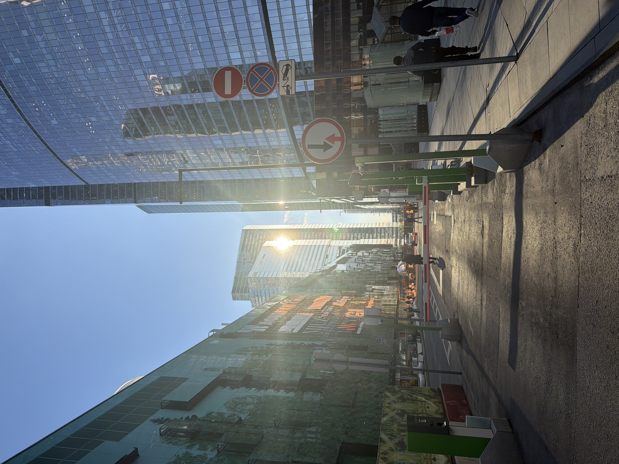 Modern glass buildings and street signs observed in Khimki