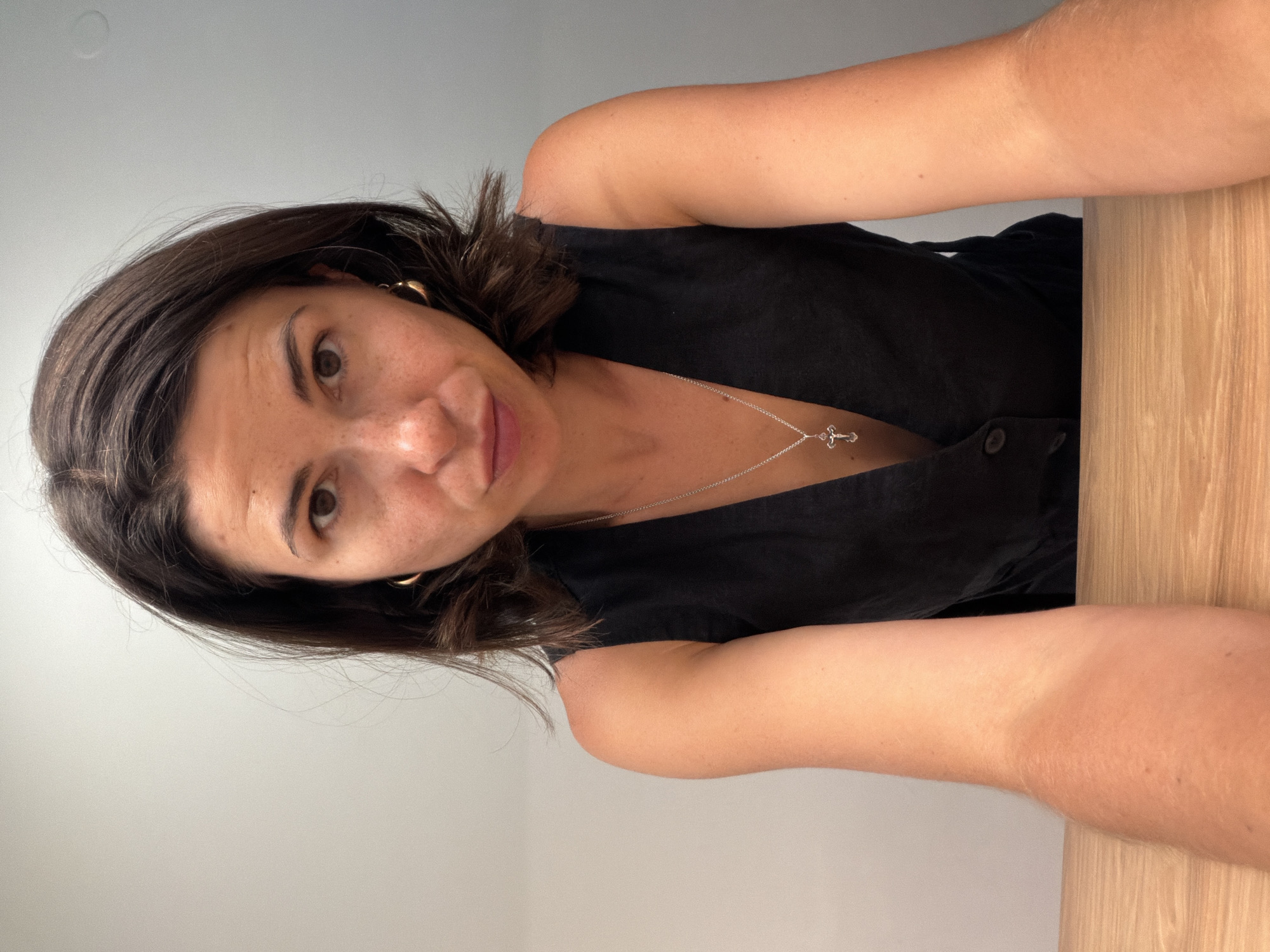 Woman takes multiple selfies indoors in Budva, Montenegro