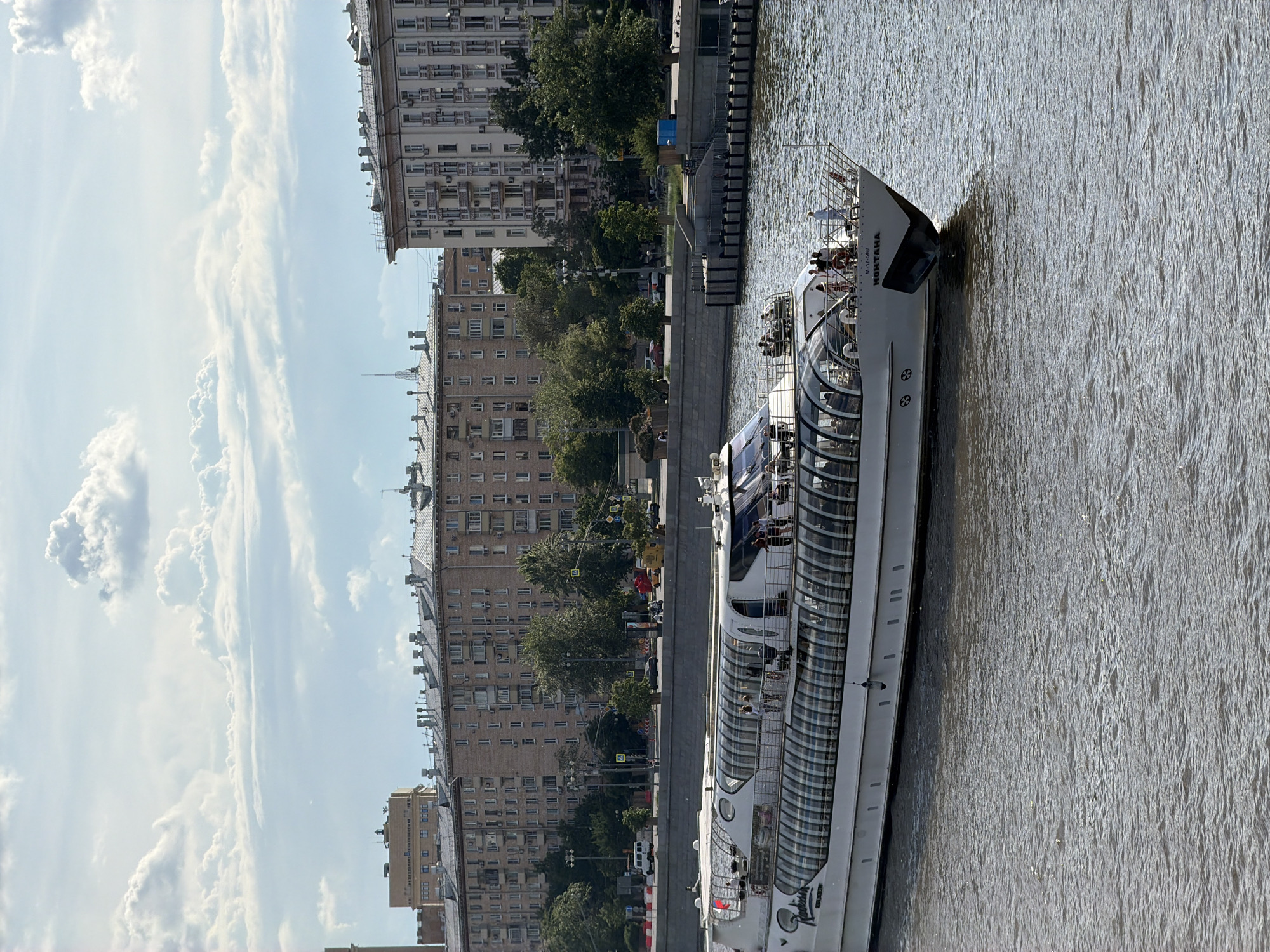 Passenger boats cruise Moscow River near Peter Great monument