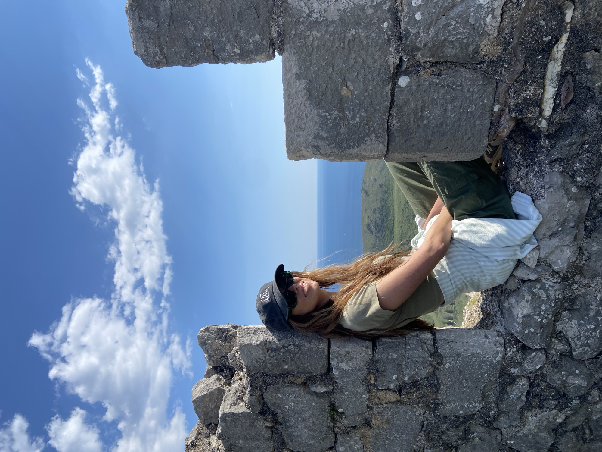 Tourist photographs herself at historic ruins in Montenegro