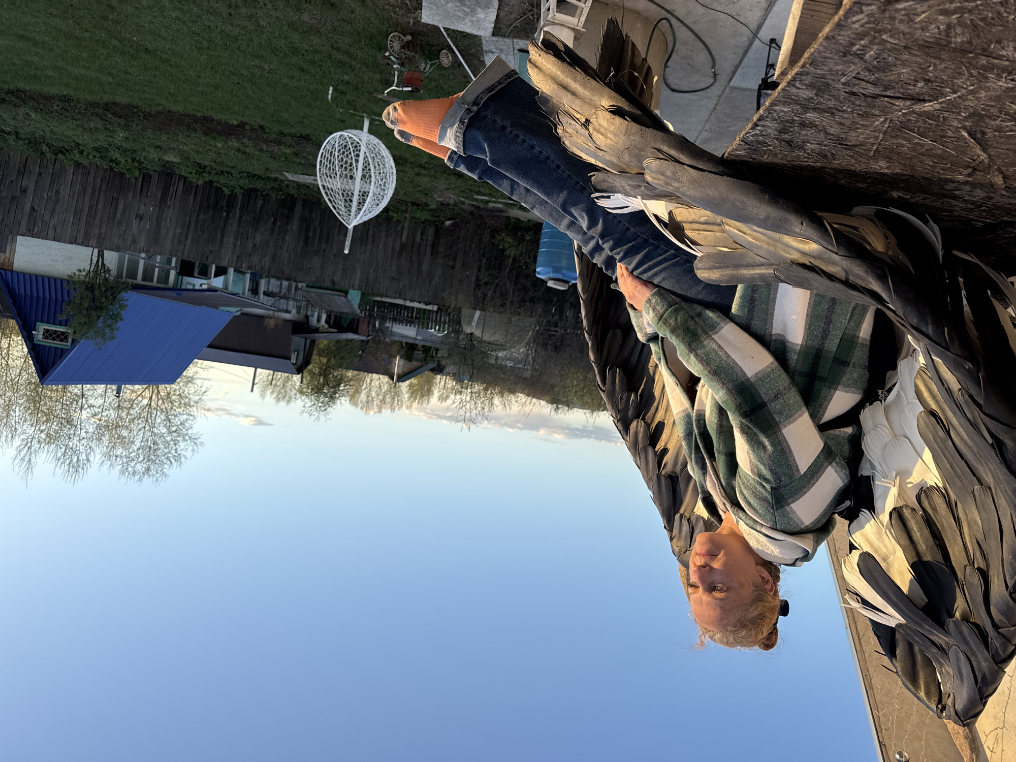 Casual backyard activities documented in Chaikovsky, Russia during afternoon