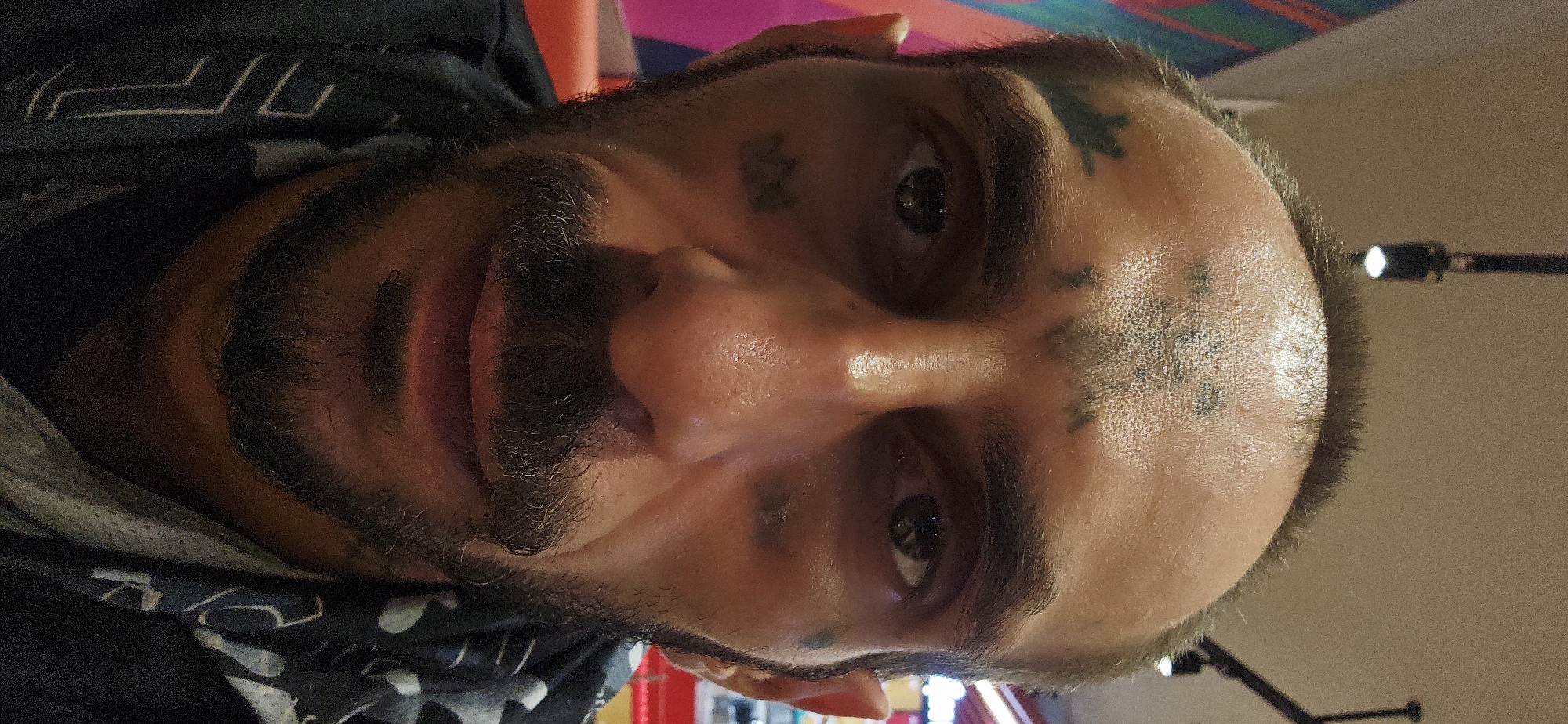 Tattooed man eats at Jollibee restaurant in Vietnam