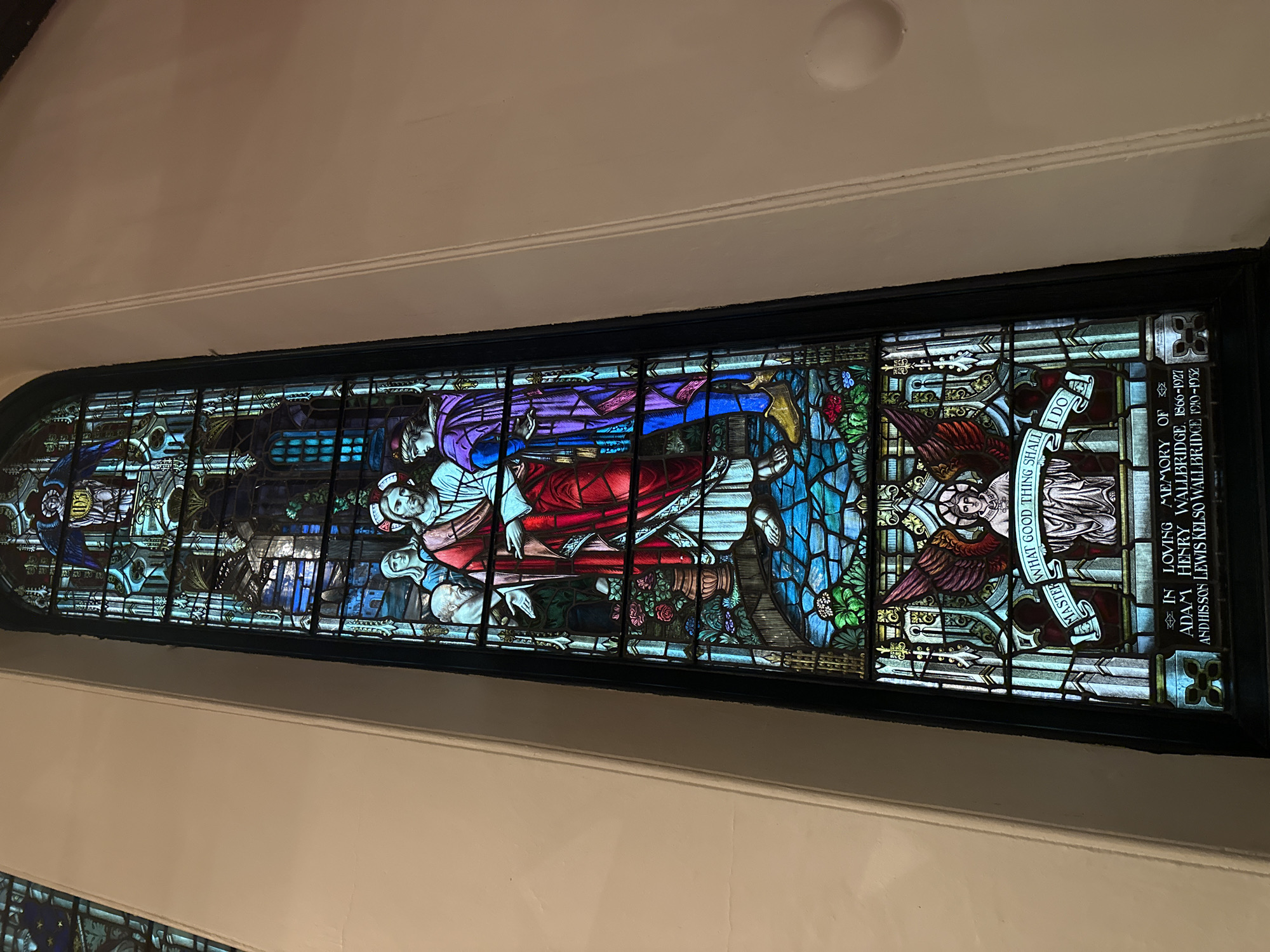 Church stained glass and a sunlit urban waterfront road