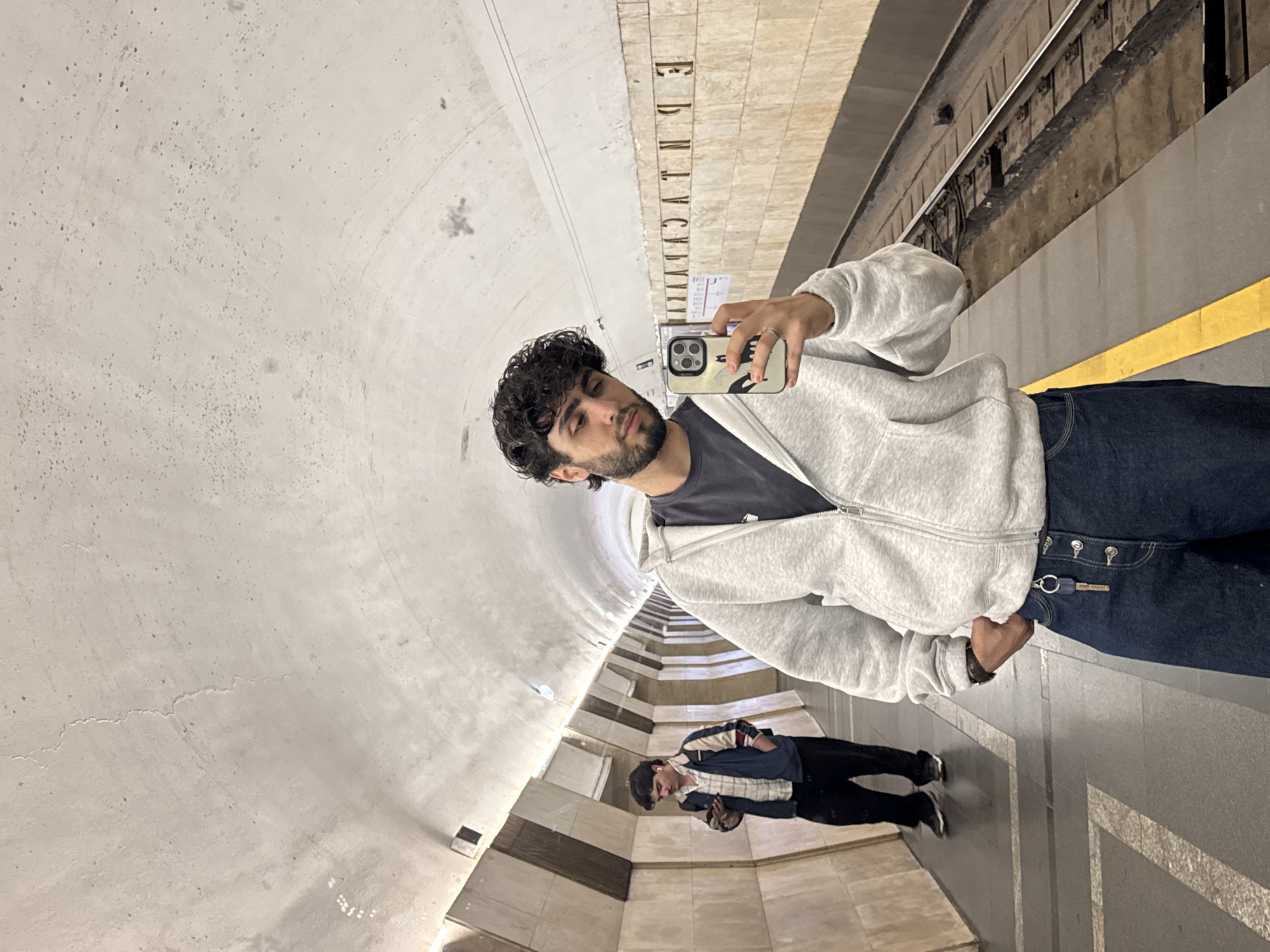 Man Takes Selfie at Subway Station
