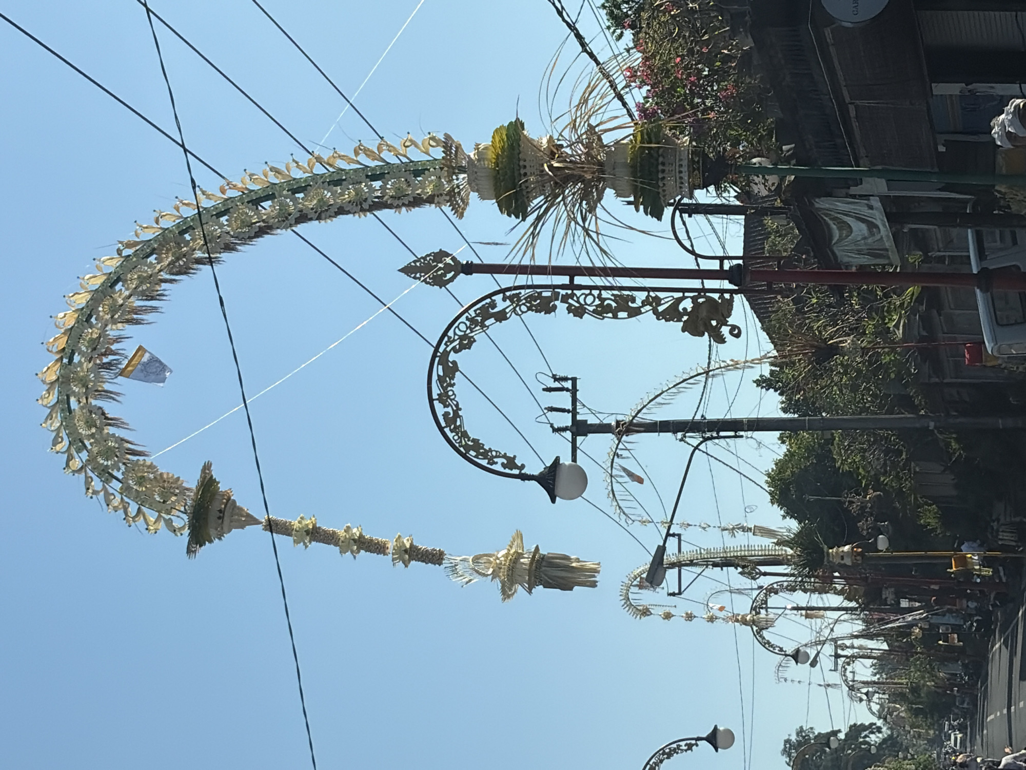 Ceremonial procession and street activity in Gianyar, Bali
