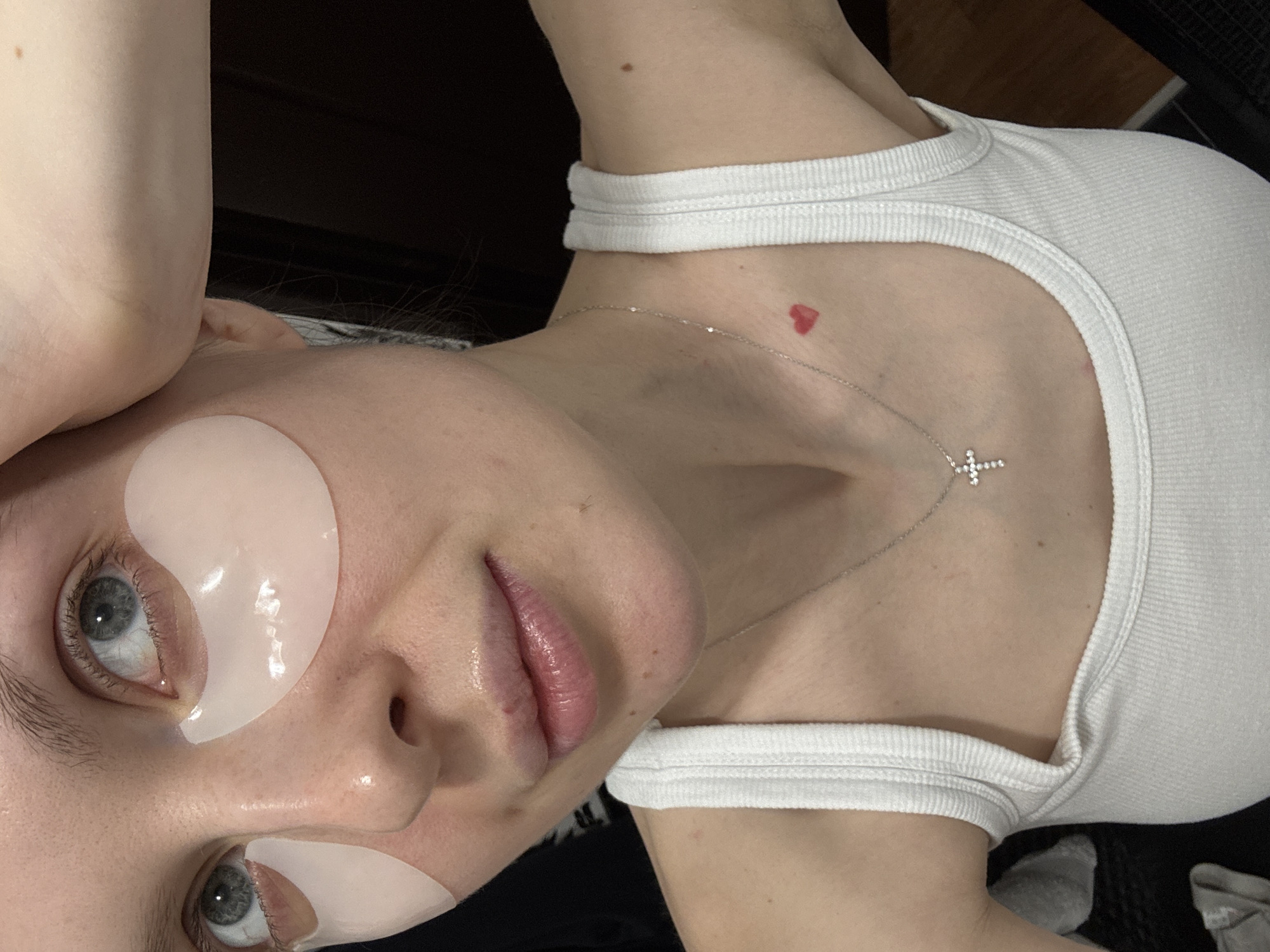 Young person spotted wearing eye masks and cross necklace in Moscow