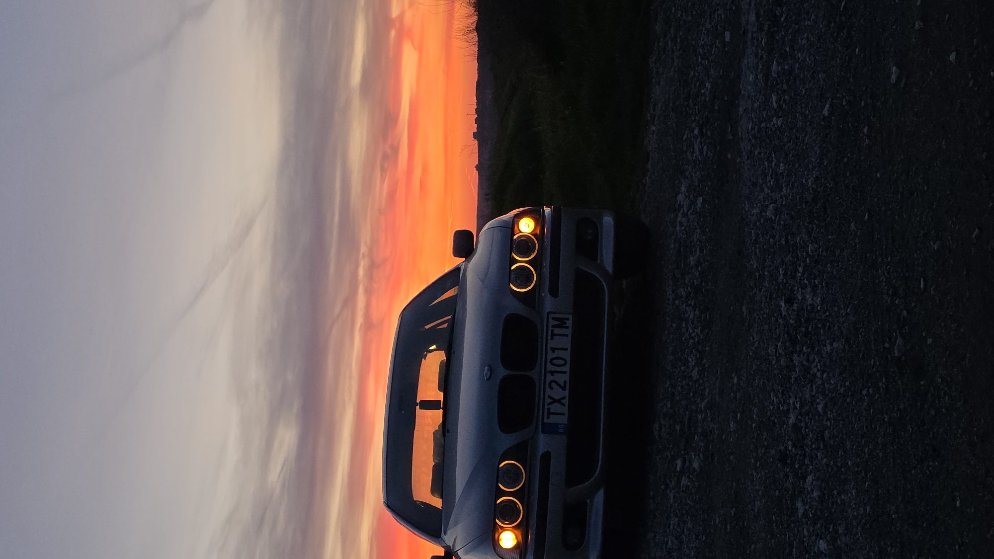 Sunset documented over coastal Balgarevo, Bulgaria with parked BMW