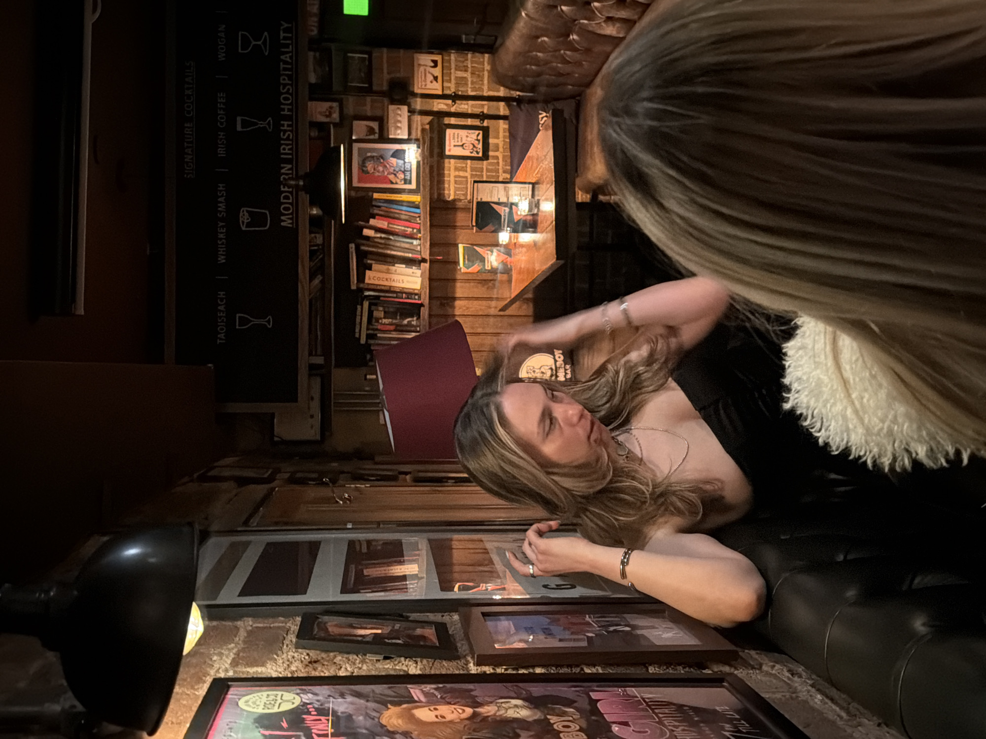 London bar patrons capture moments with phones during evening
