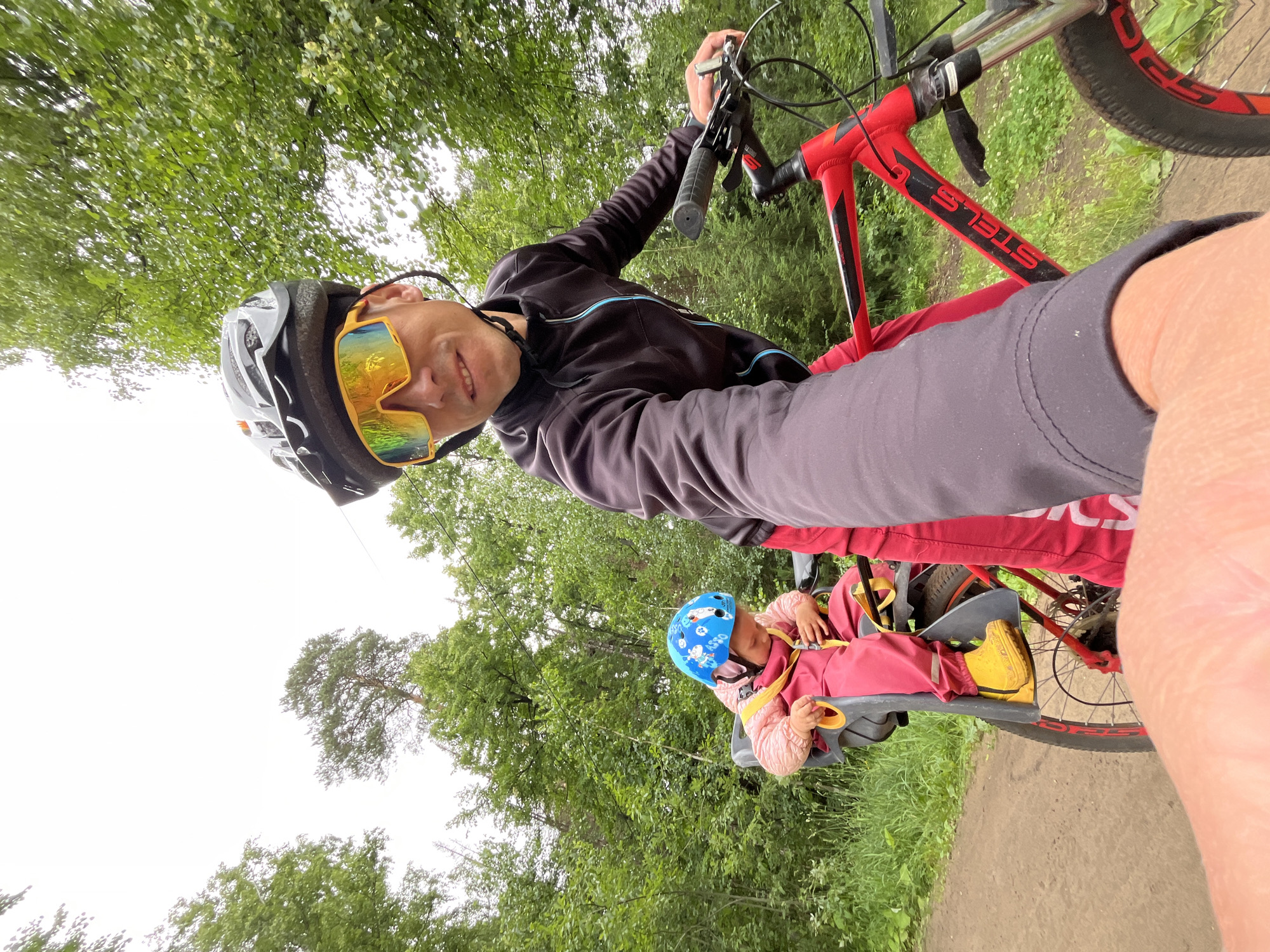 Family bike ride through forest trails in Chaikovsky, Russia