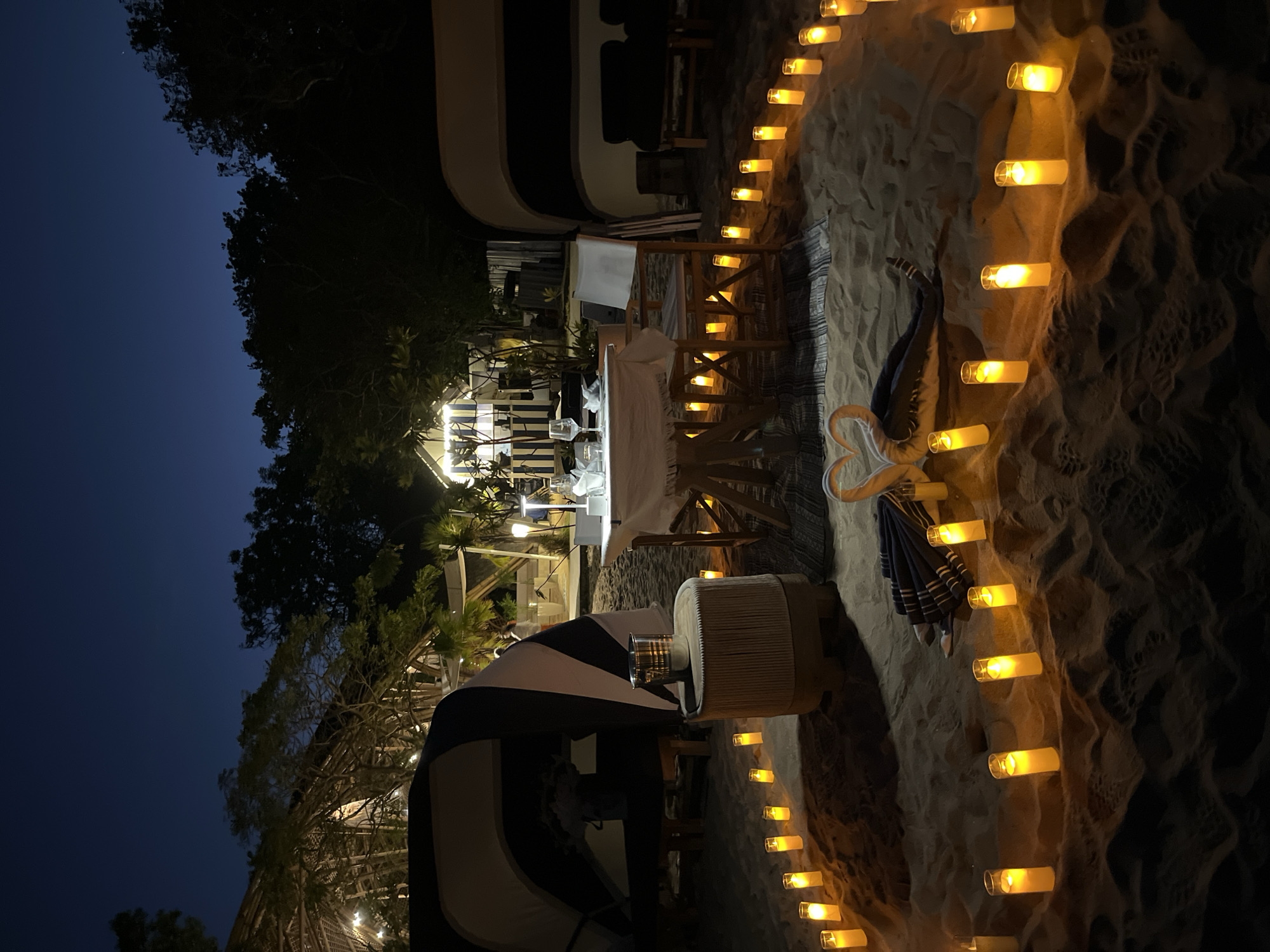 Beachfront wedding and candlelit dinners on a Bali shoreline