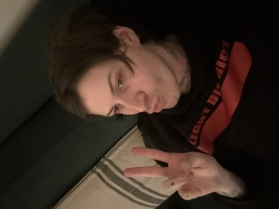 Young adult photographed indoors in London