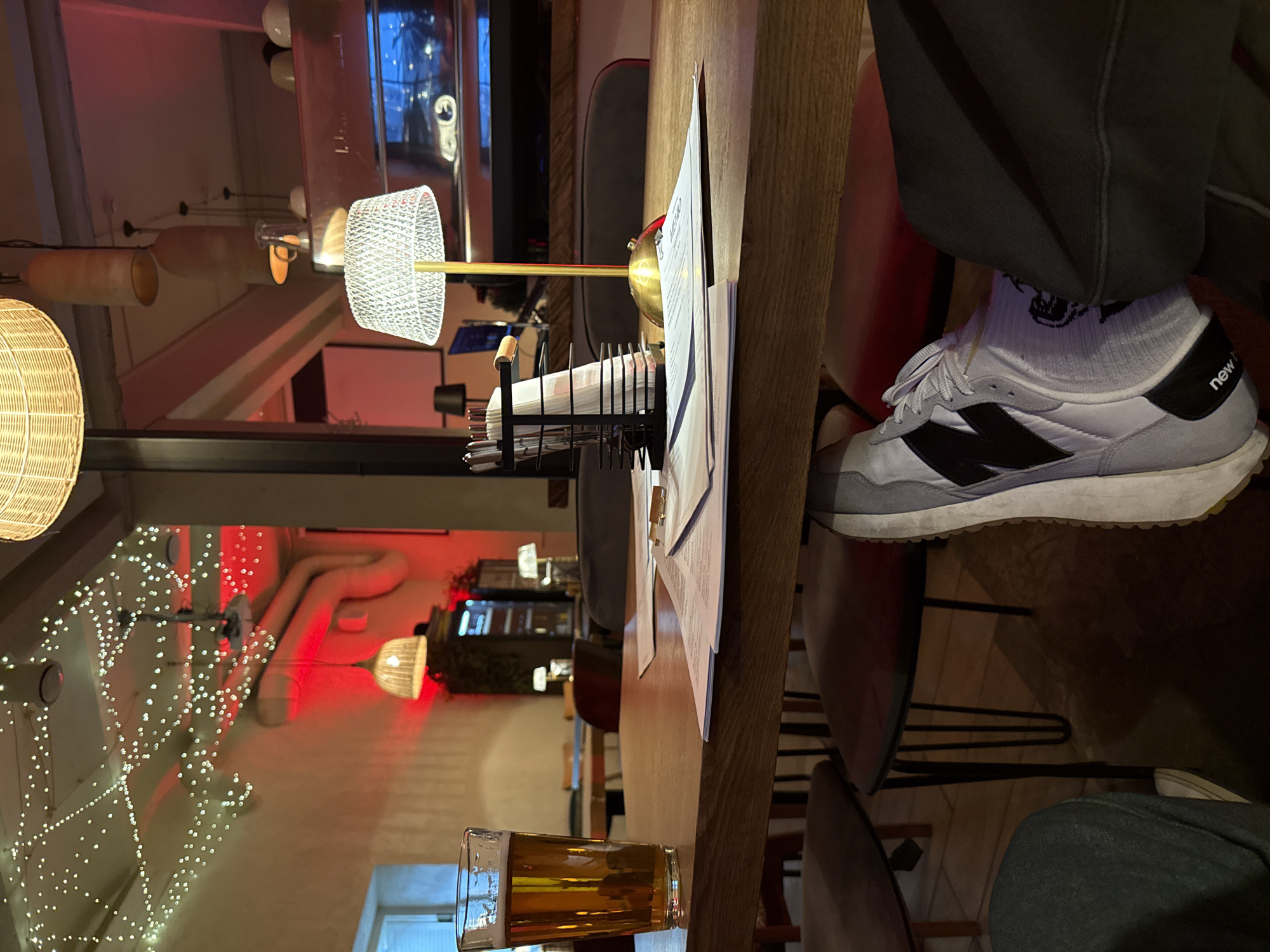 Beer and menu captured at Moscow restaurant table