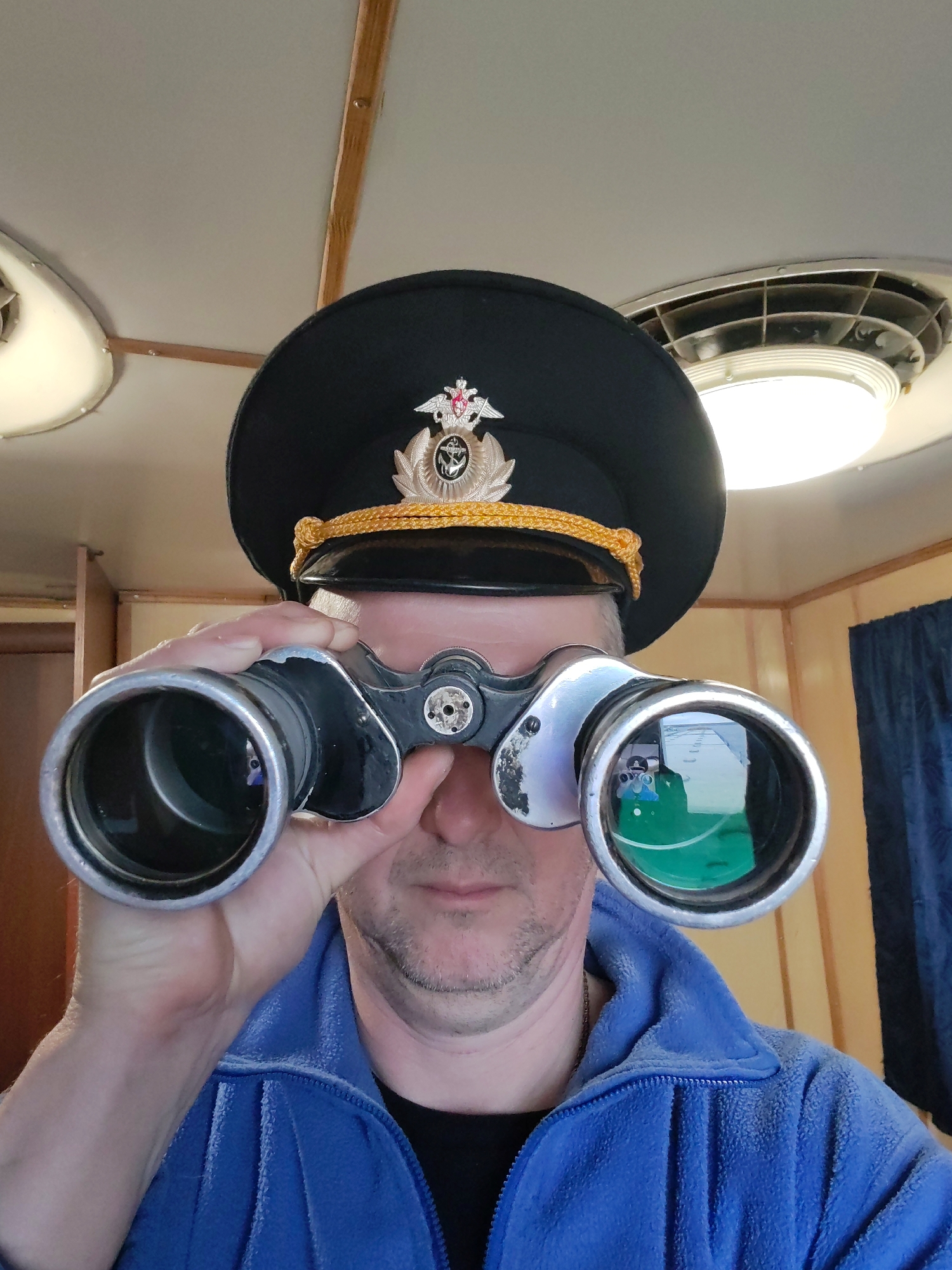 Ship observer watches cargo vessel navigate Russian waterway