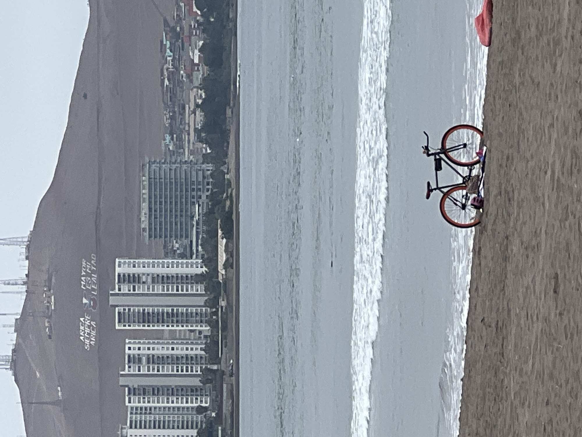 Afternoon beach scene documented at Arica, Chile waterfront establishments