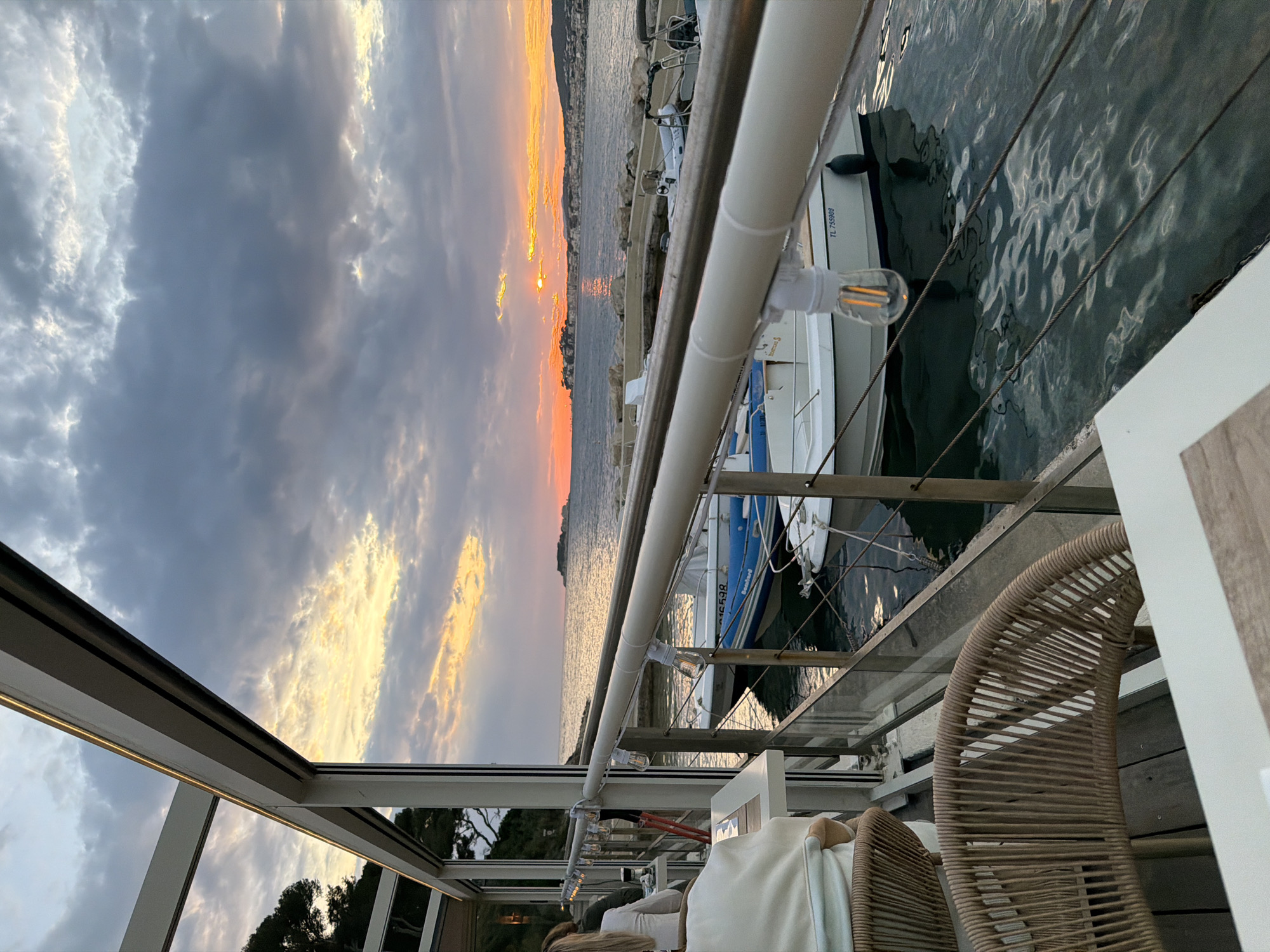 Sunset observed over Sanary-sur-Mer marina from waterfront location