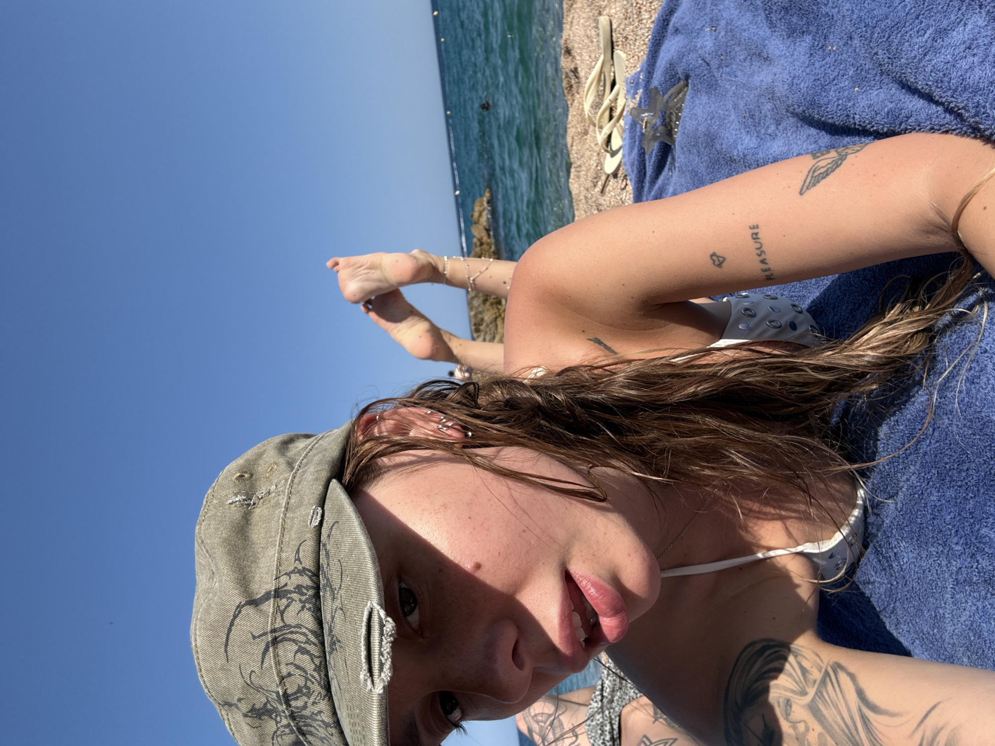 Lazy afternoon on a pebble beach in Platja d'Aro