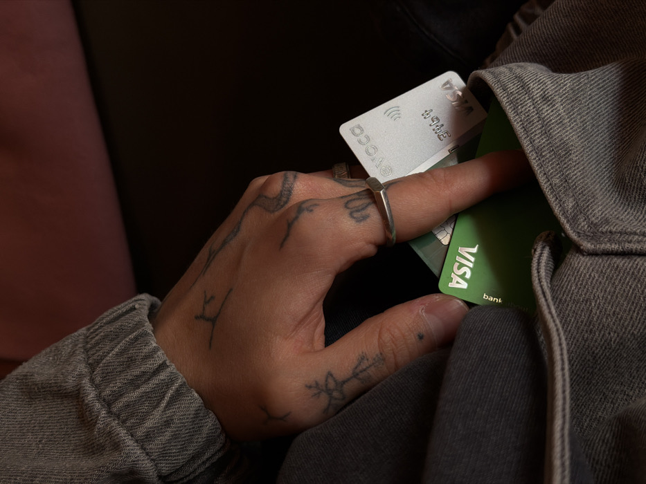 Tattooed individual documents credit card handling, selfies in Yerevan