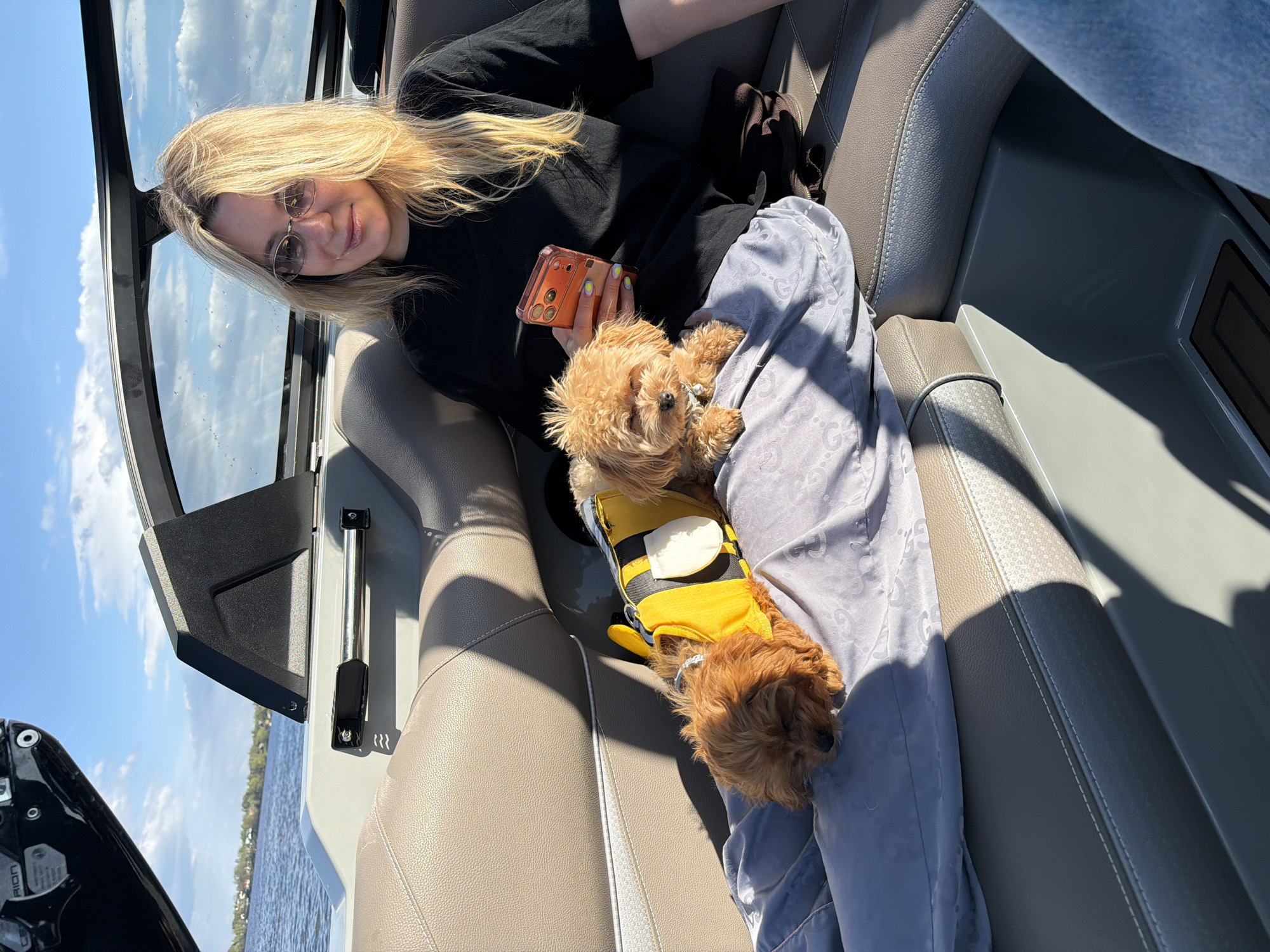 Woman enjoys boat outing with costumed dogs in Russia