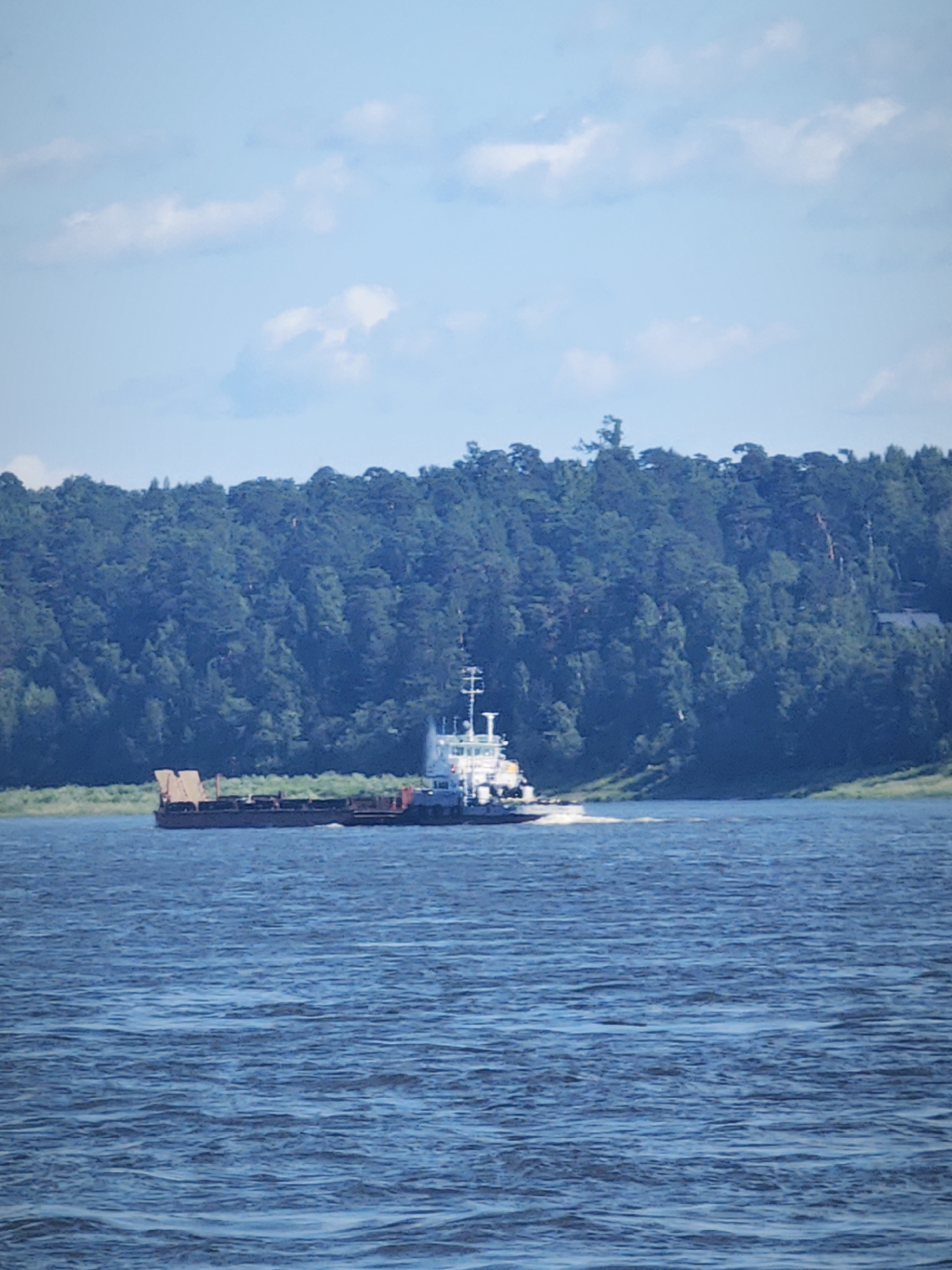 Tugboats, barges, and cranes on the Angara River