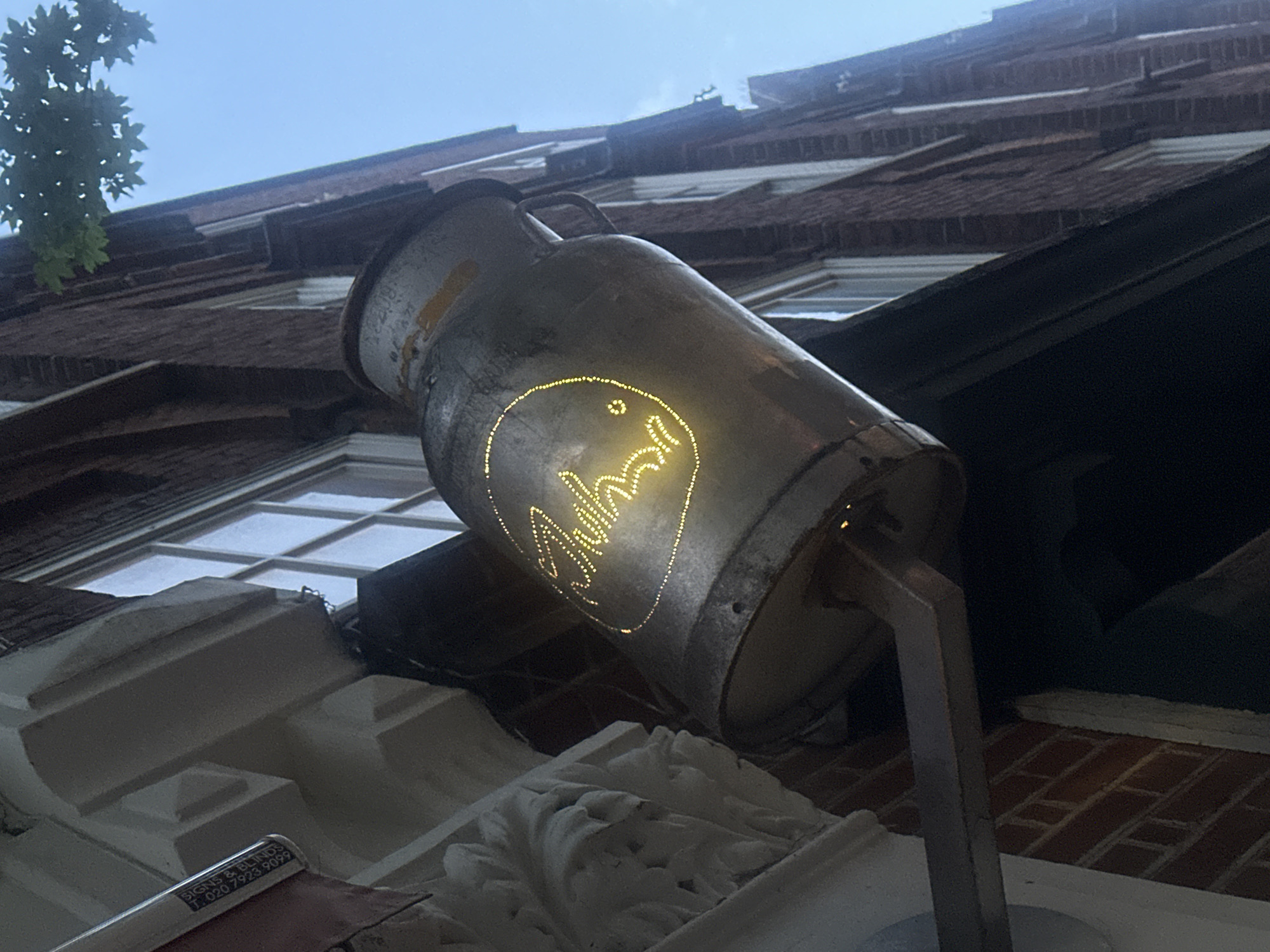 Vintage milk churn sign "Ahasi" spotted in London