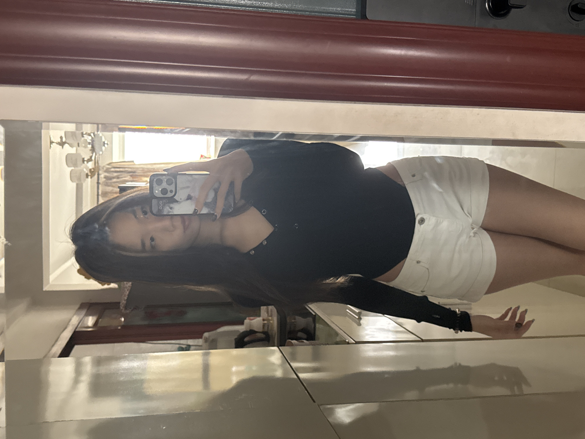 Woman takes multiple selfies in decorated bedroom during early morning