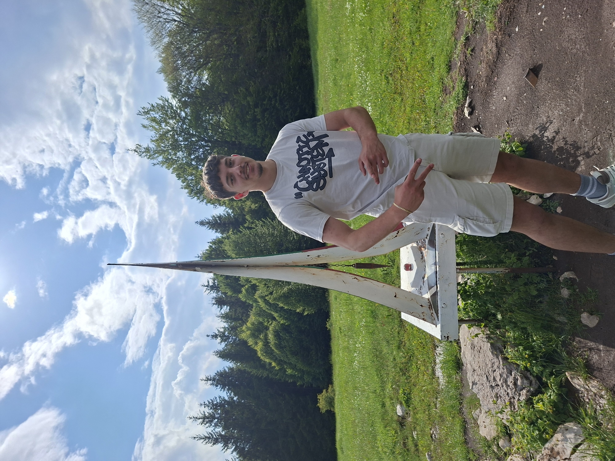 Man photographed near geodetic monument in Gabrovo countryside