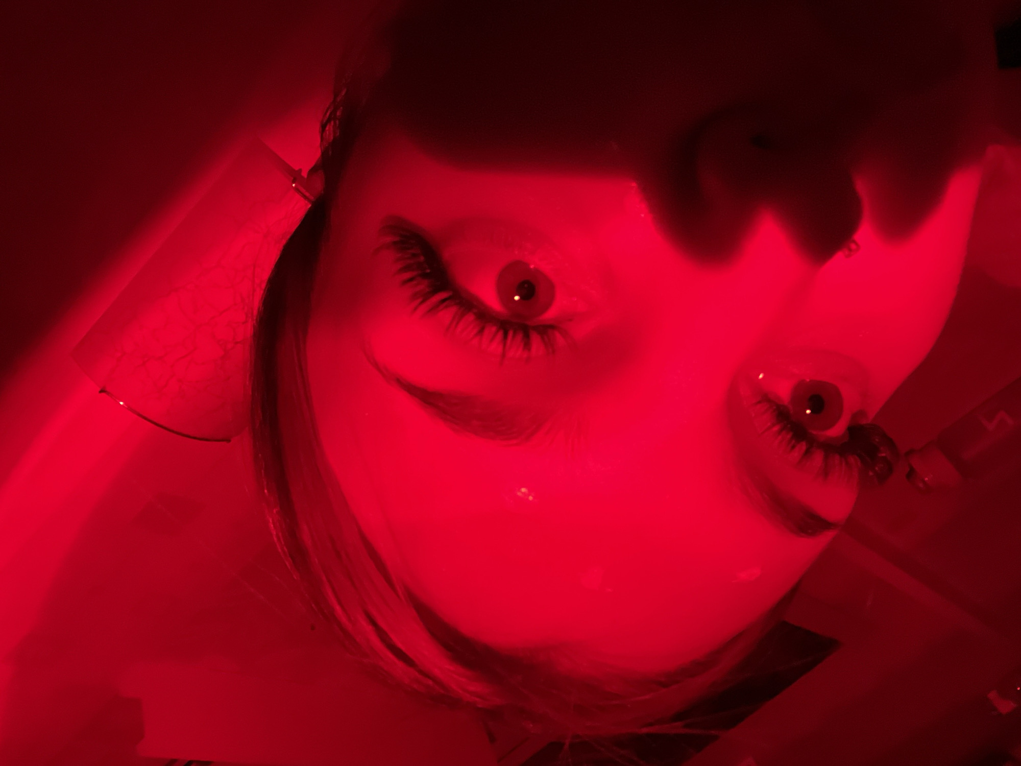 Red-lit portrait session documented in Russia