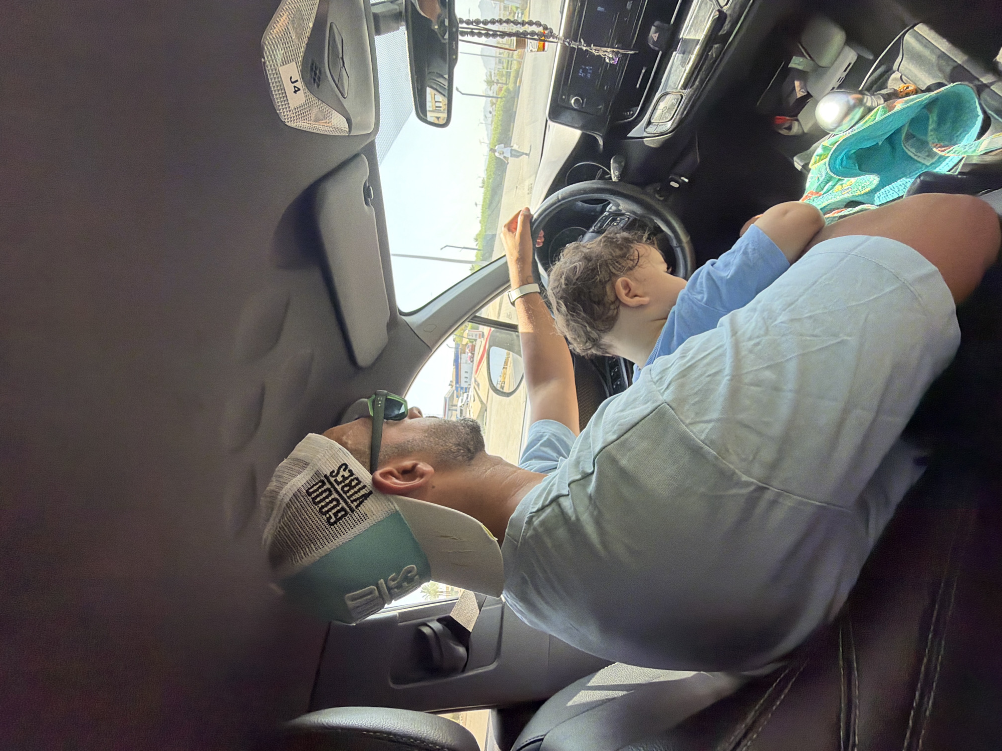 Good Vibes cap, steering wheel, Sharm El Sheikh road trip