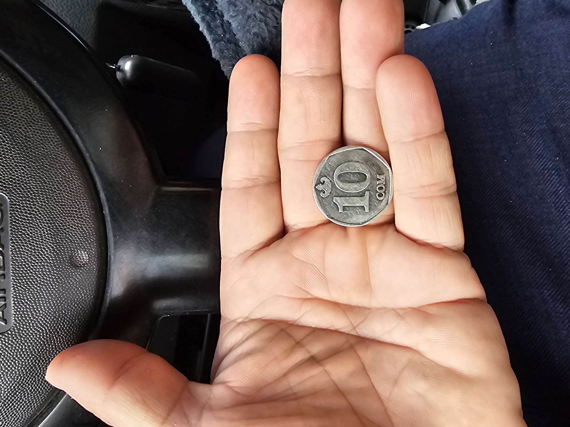Driving through Özgön: landmarks, landscapes, and a local coin