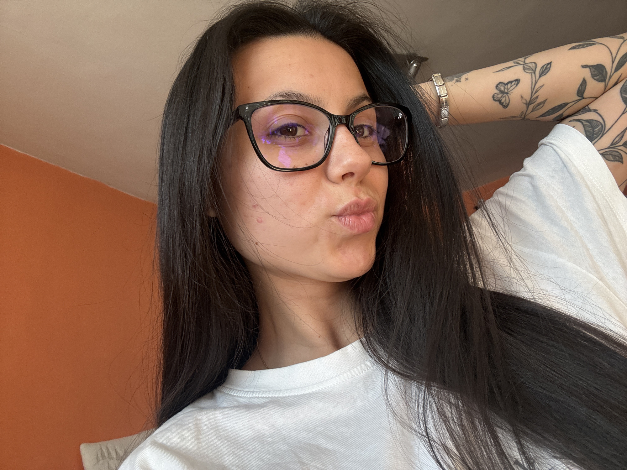 Woman poses for photos in Sliven, displaying tattoos