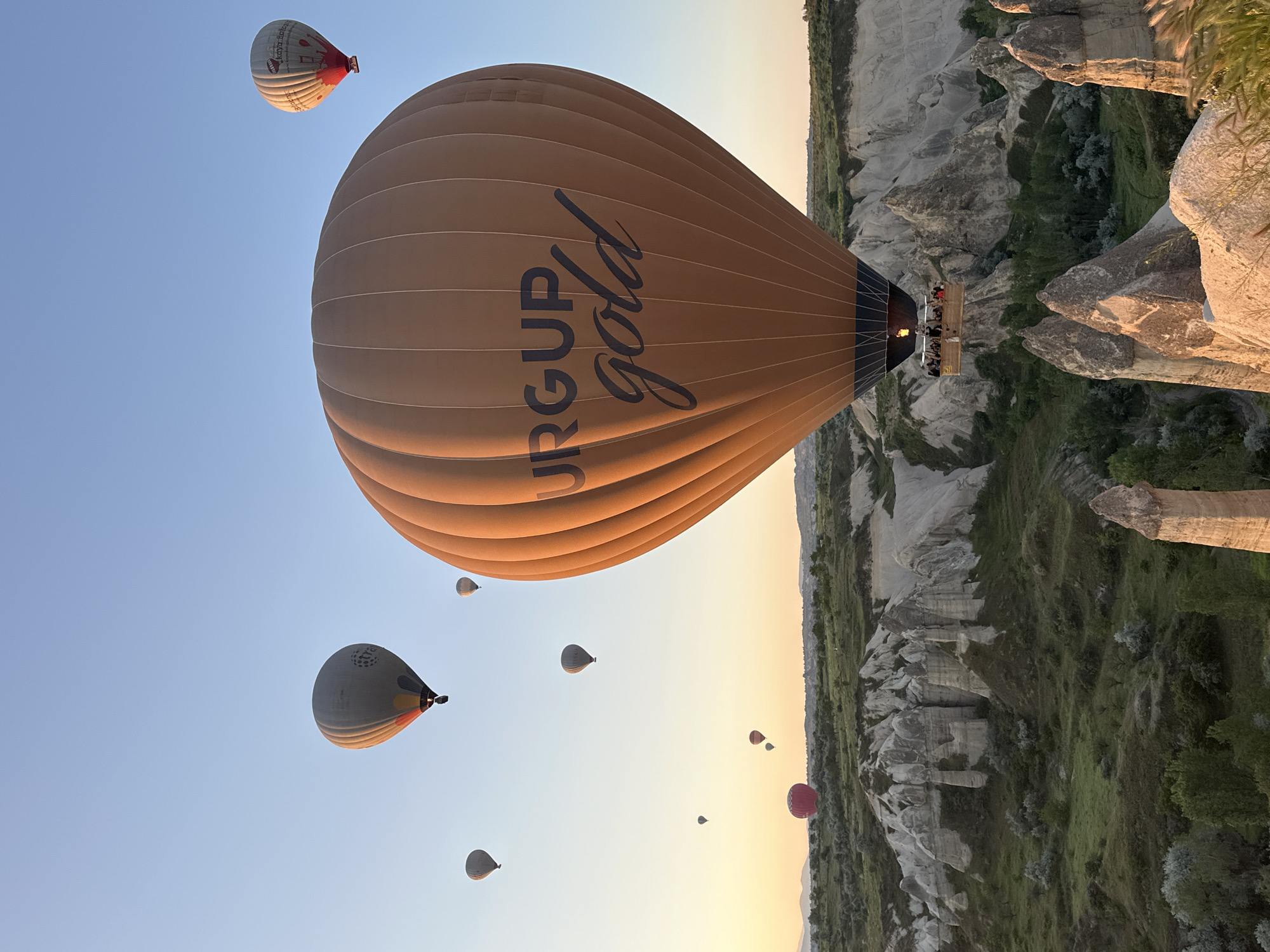 Hot air balloon fleet launches at sunrise in Cappadocia