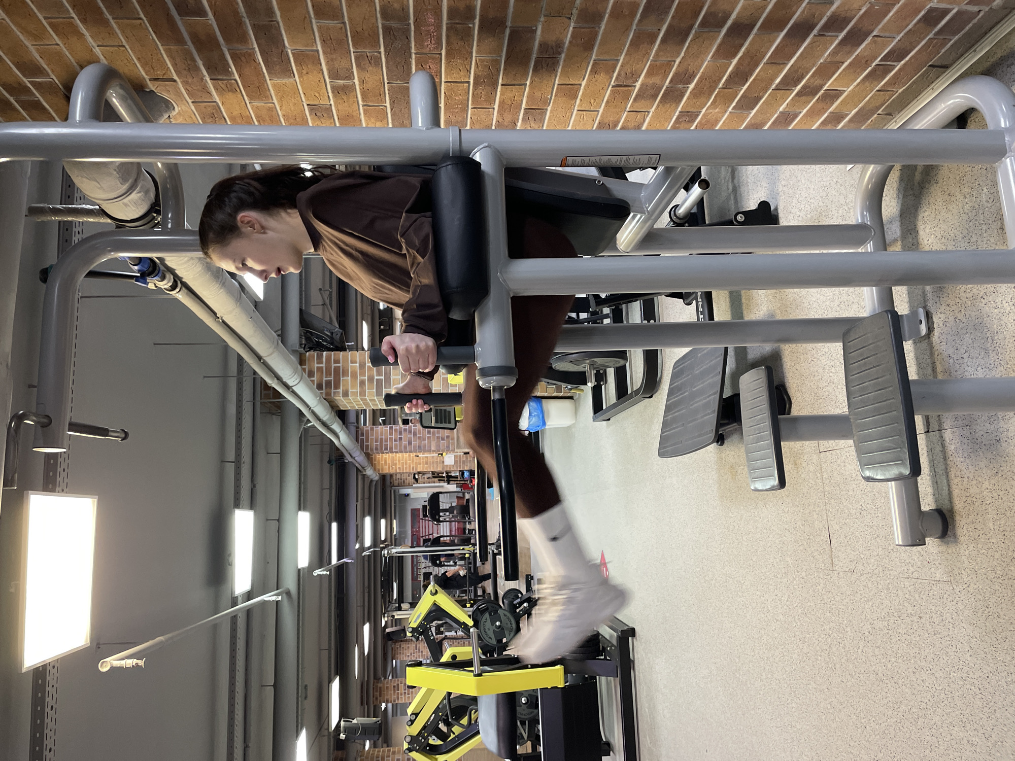 Woman conducts early morning workout session at Izhevsk gym