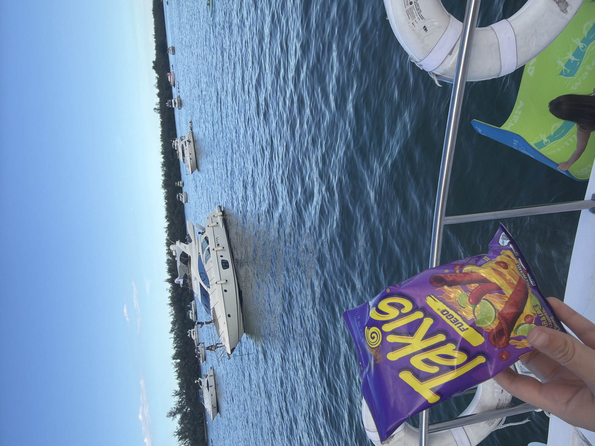 Miami boat day with Takis, drinks, and skyline views