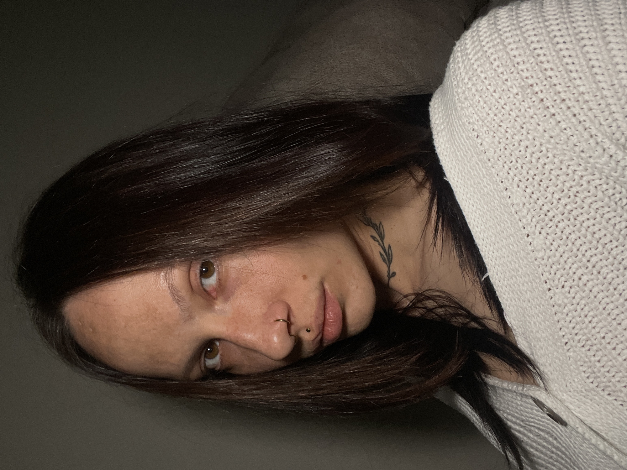 Woman with tattoo, piercings observed resting in Izhevsk