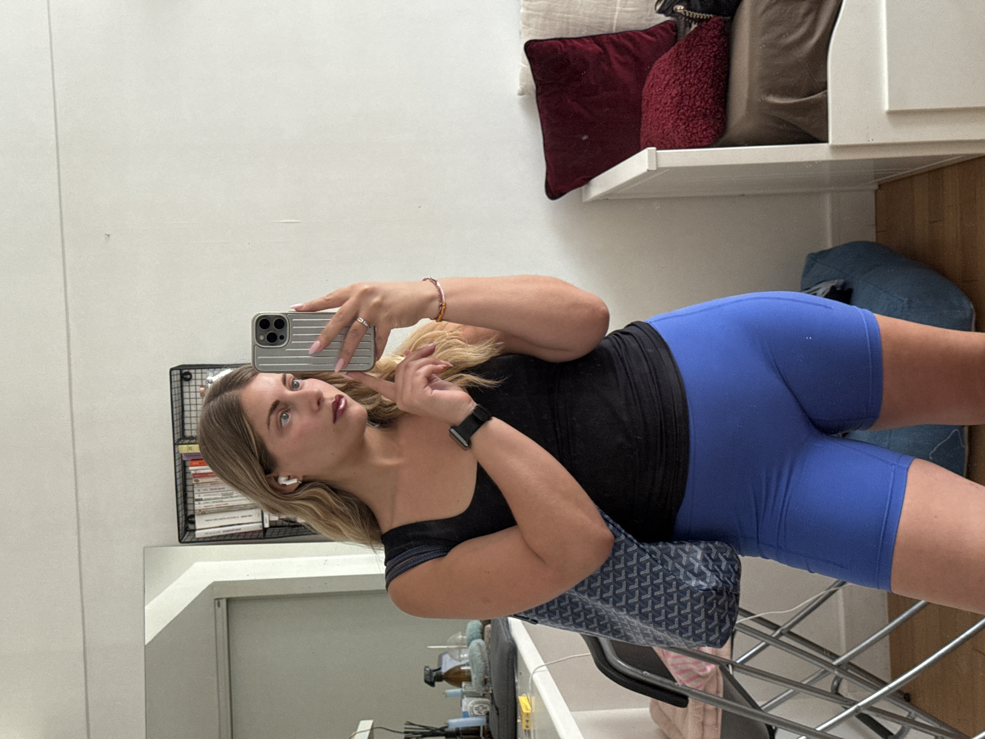Woman takes selfies in mirror at Paris residence