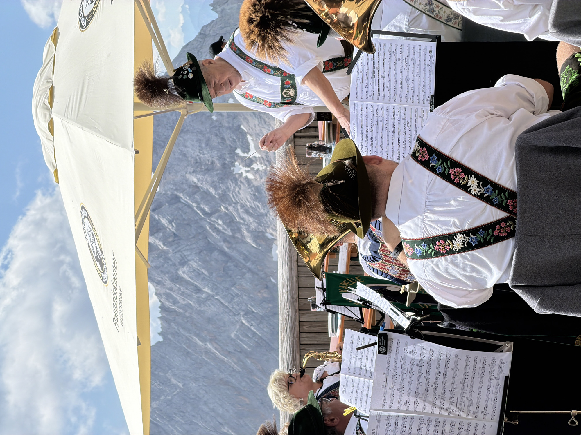 Brass band plays traditional set at Alpine outdoor venue, Austria