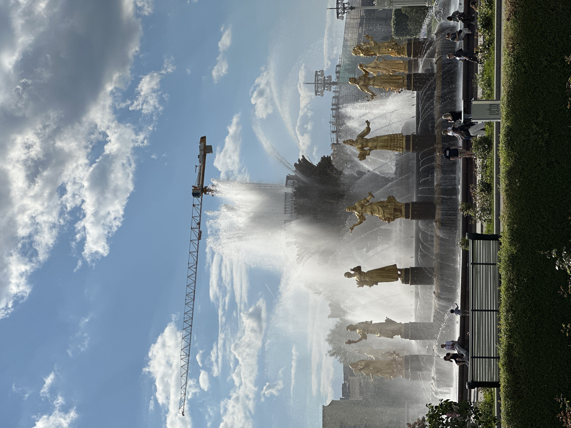 Visitor documents sunny afternoon at Moscow's VDNKh park