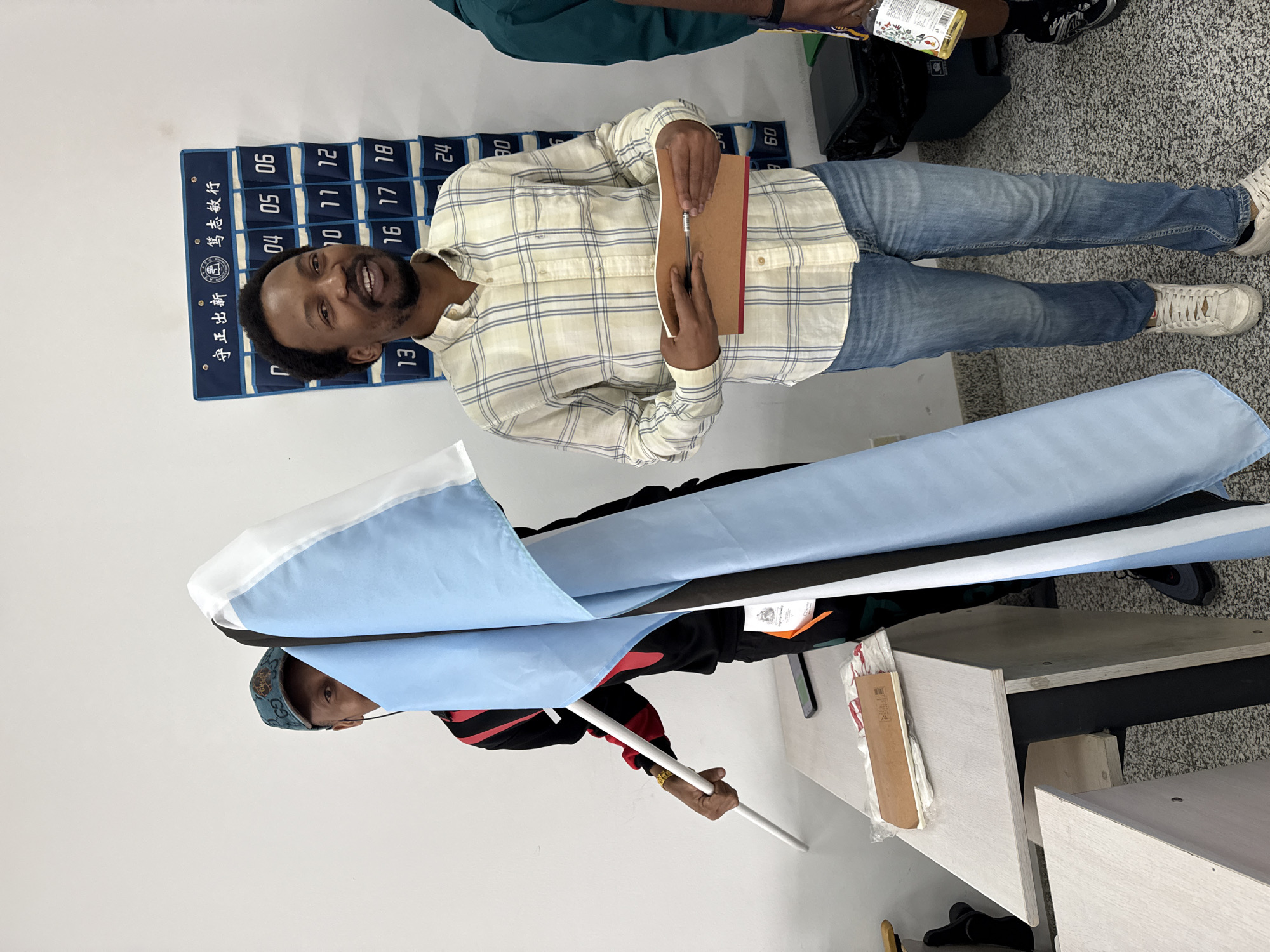 Group displays Botswana flag indoors in Beijing district