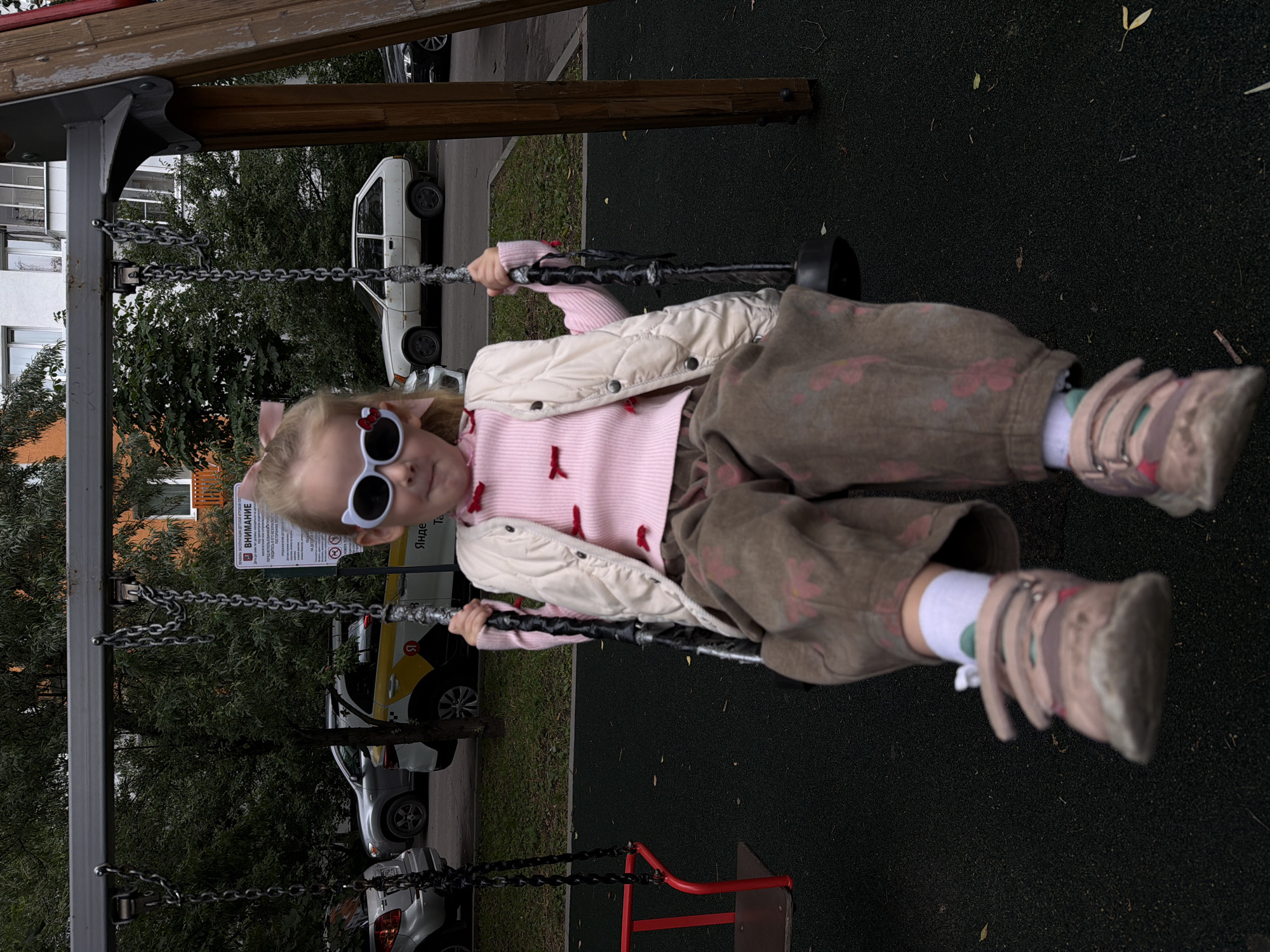 Swing time at a Khimki playground, July morning