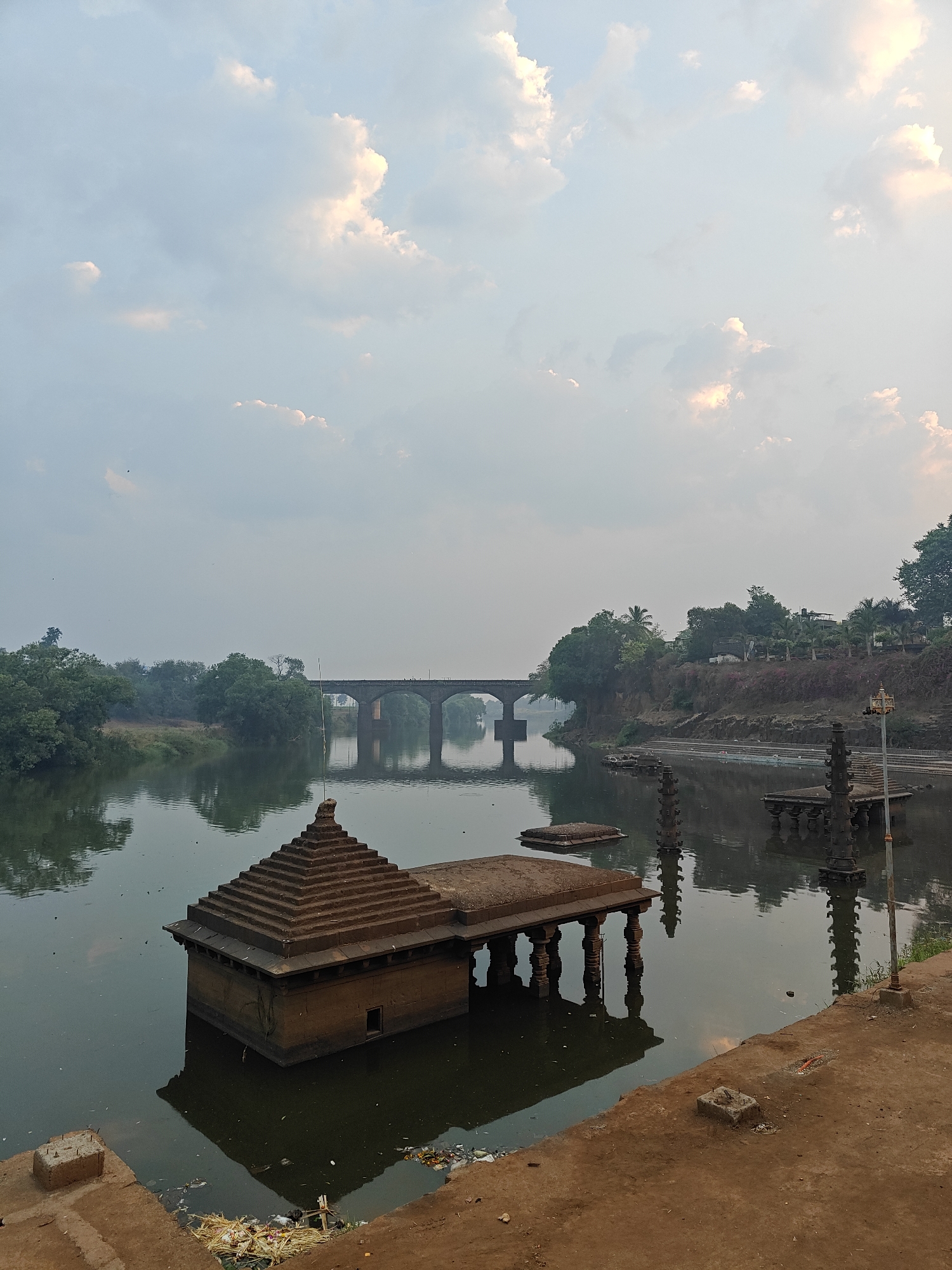 Evening documentation of Kolhapur's historic temples and riverfront