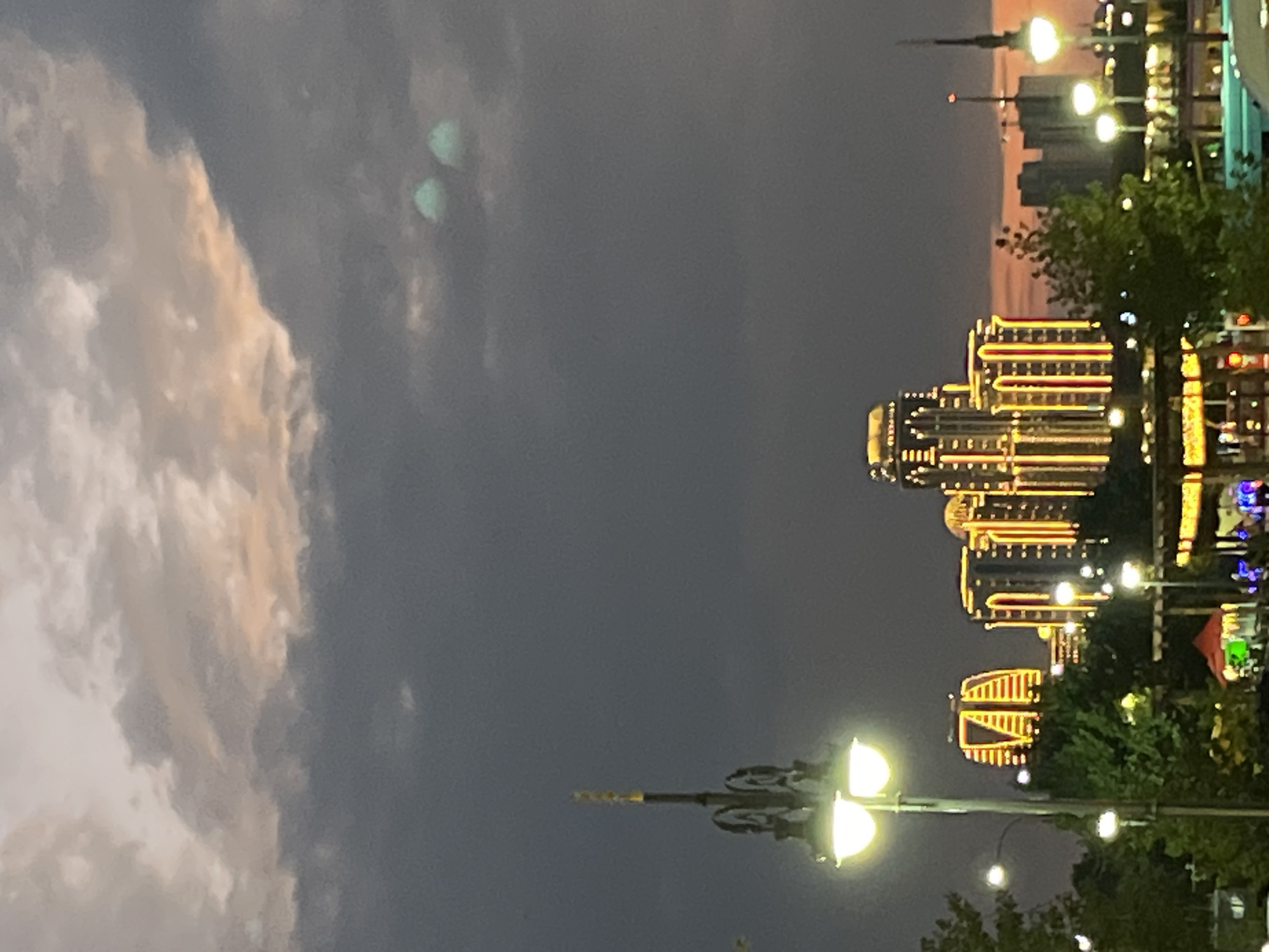 Grozny skyscrapers glow against a dramatic dusk sky