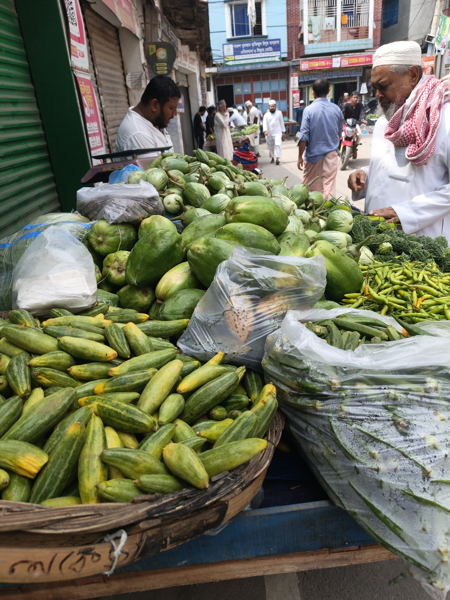 Fresh produce and street food at a Dhaka morning market