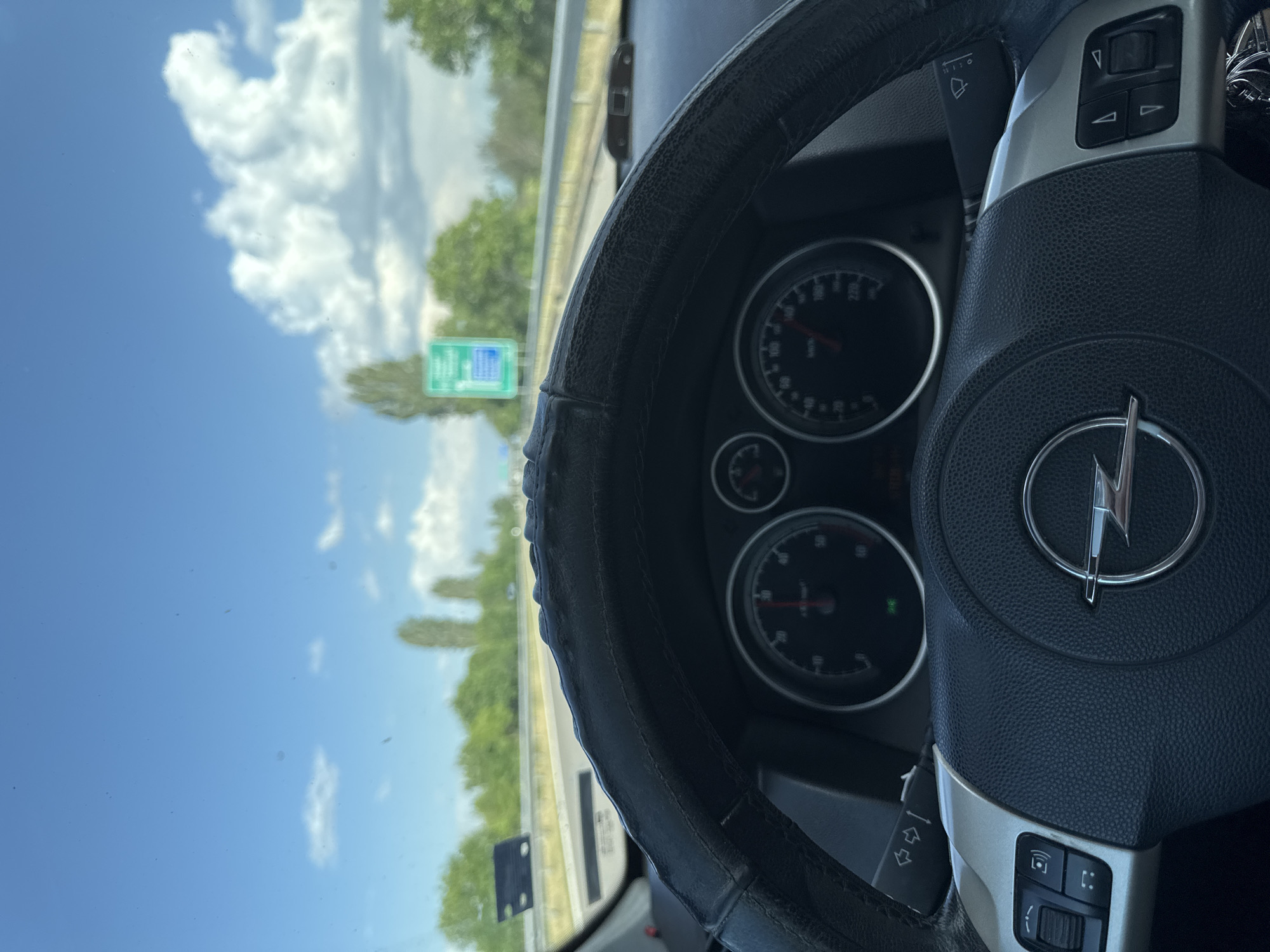 Driver documents Opel car interior during highway journey in Bulgaria