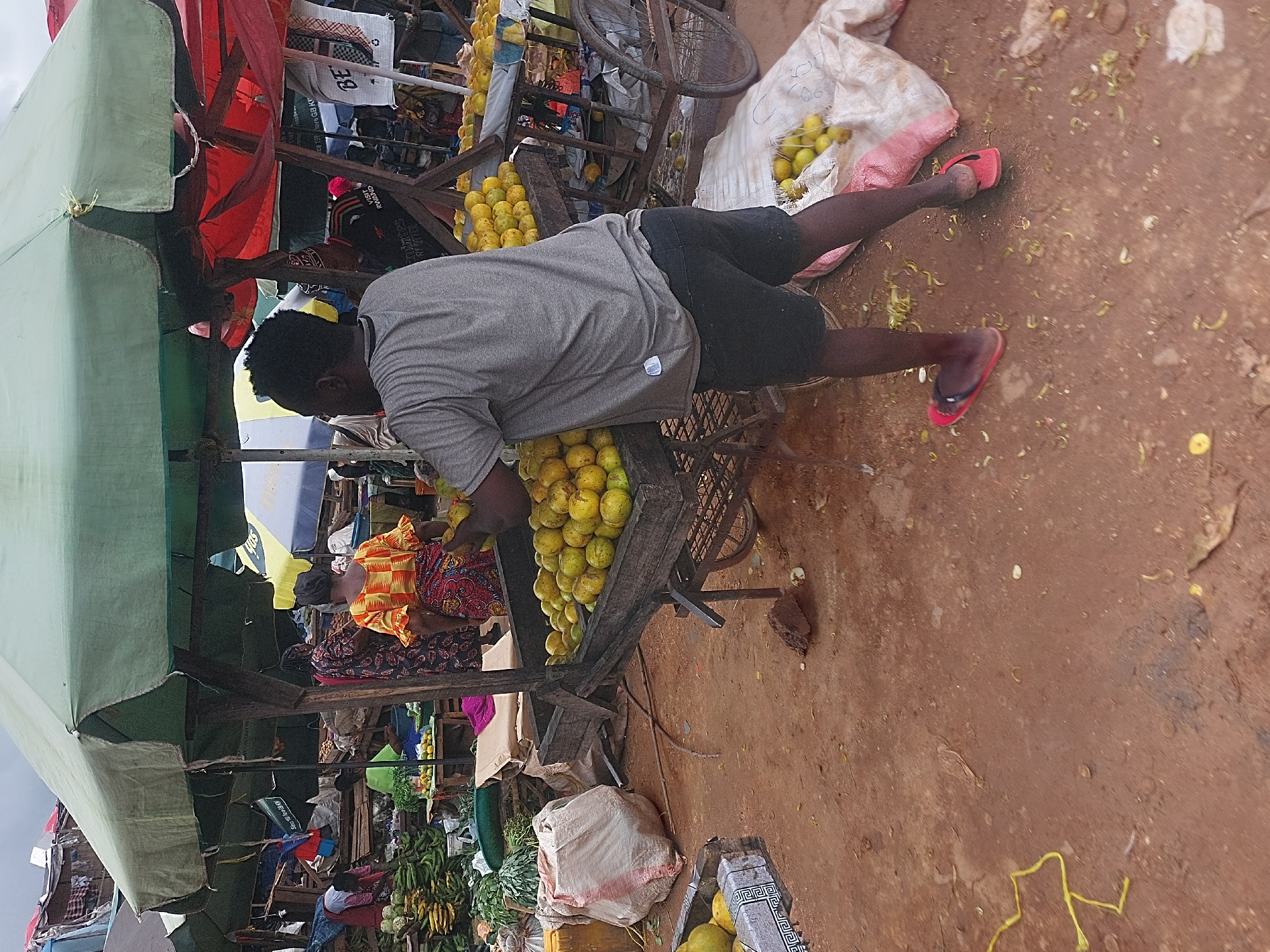 Morning marketplace bustles with vendors and shoppers in Dar es-Salaam