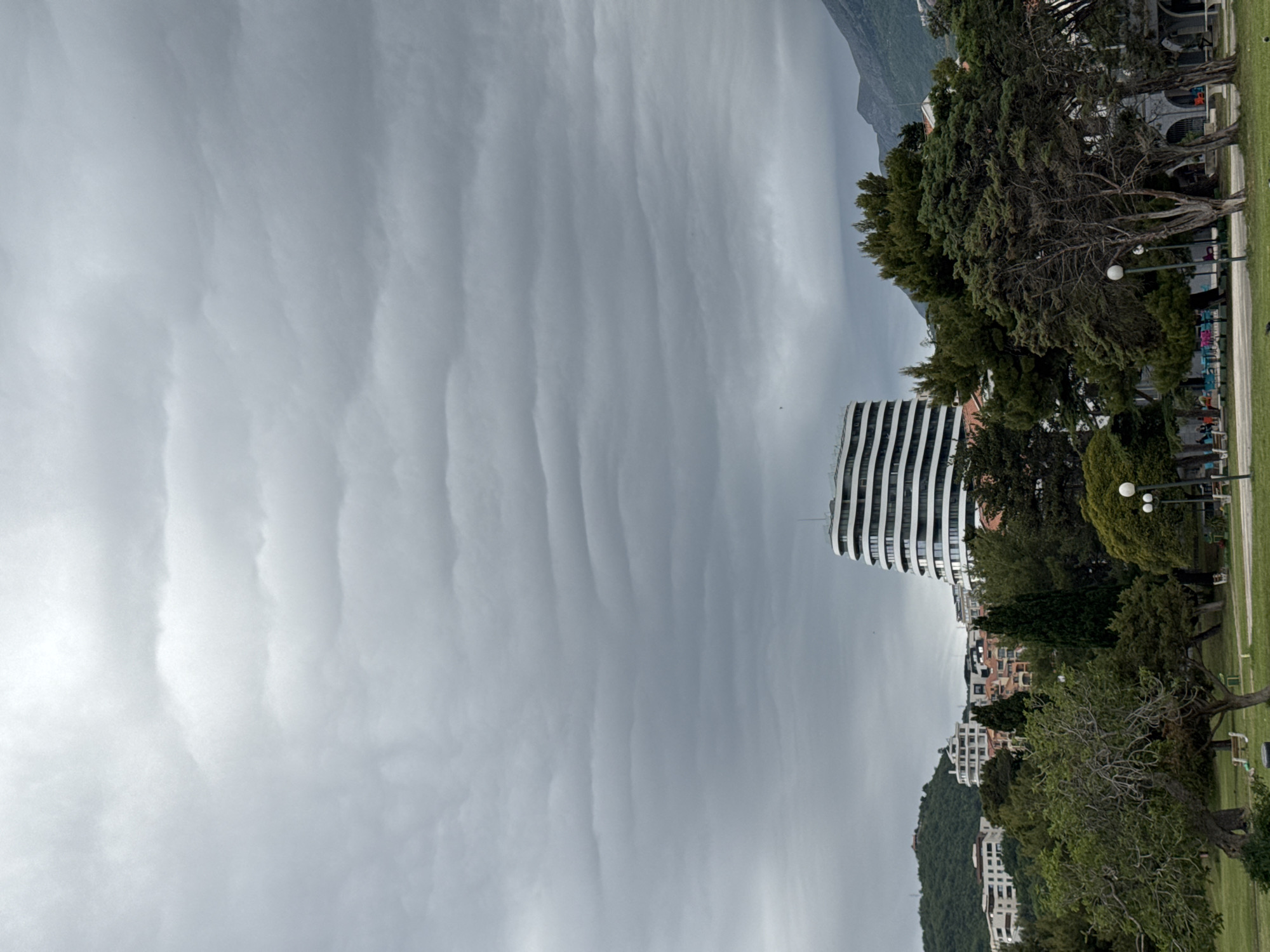 Altocumulus clouds observed over modern building in Montenegro