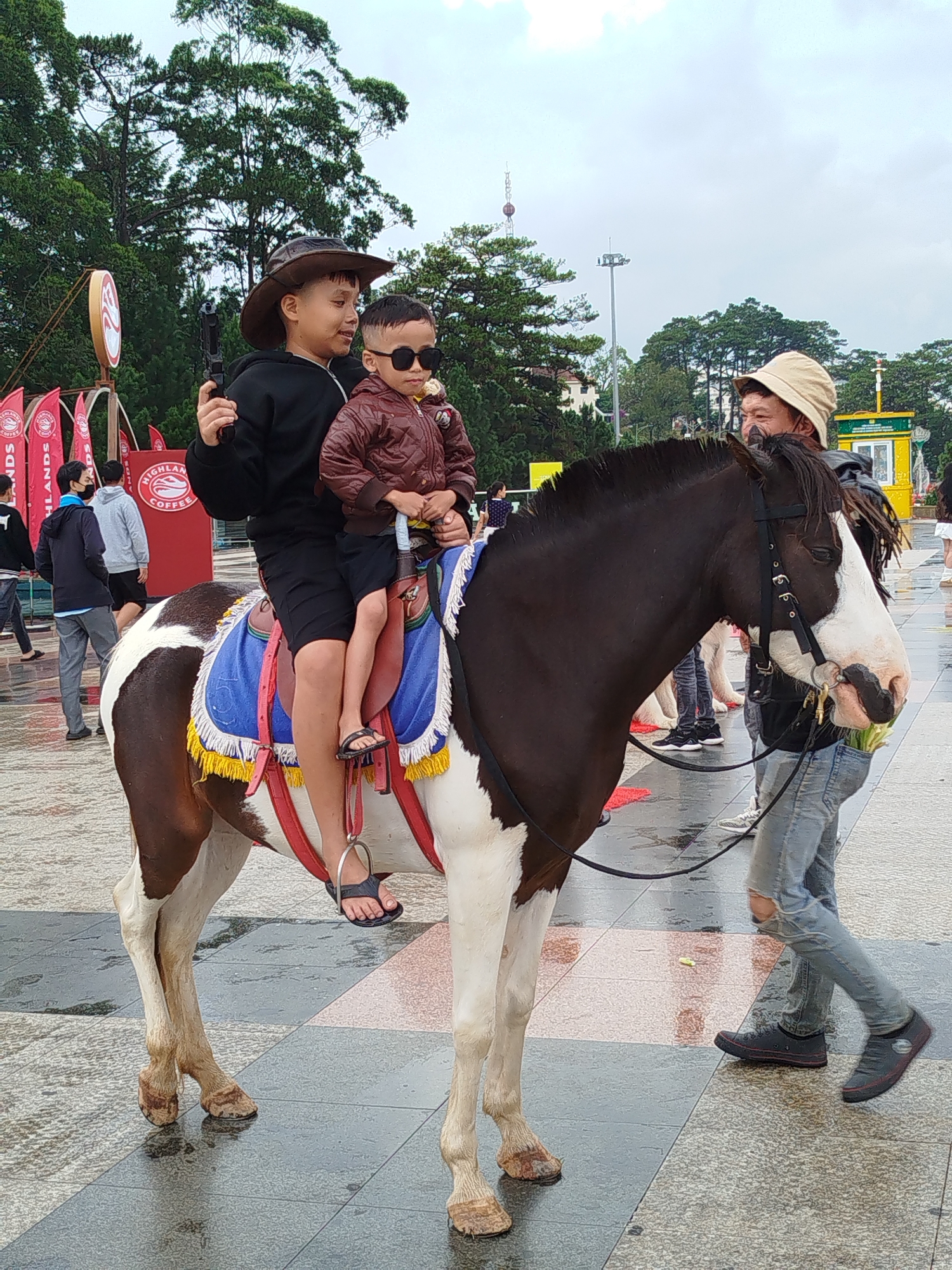 Children ride horse near Da Lat's Xuan Huong Lake